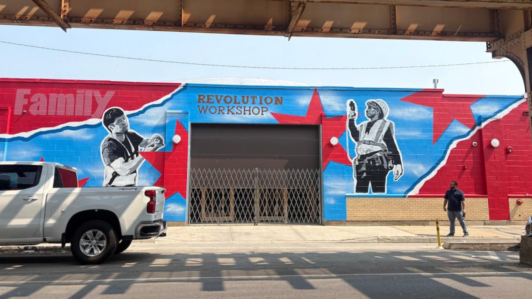 Manny Rodriguez looks down the street in front of Revolution Workshop. (Maggie Dougherty / Medill Illinois News Bureau)