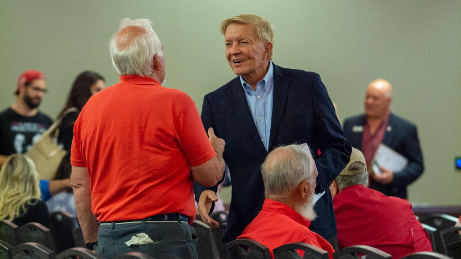 Attorney Bob Fioretti shakes hands at the Republican State Central Committee breakfast in Springfield. He’s running for attorney general in 2026. (Jerry Nowicki / Capitol News Illinois)