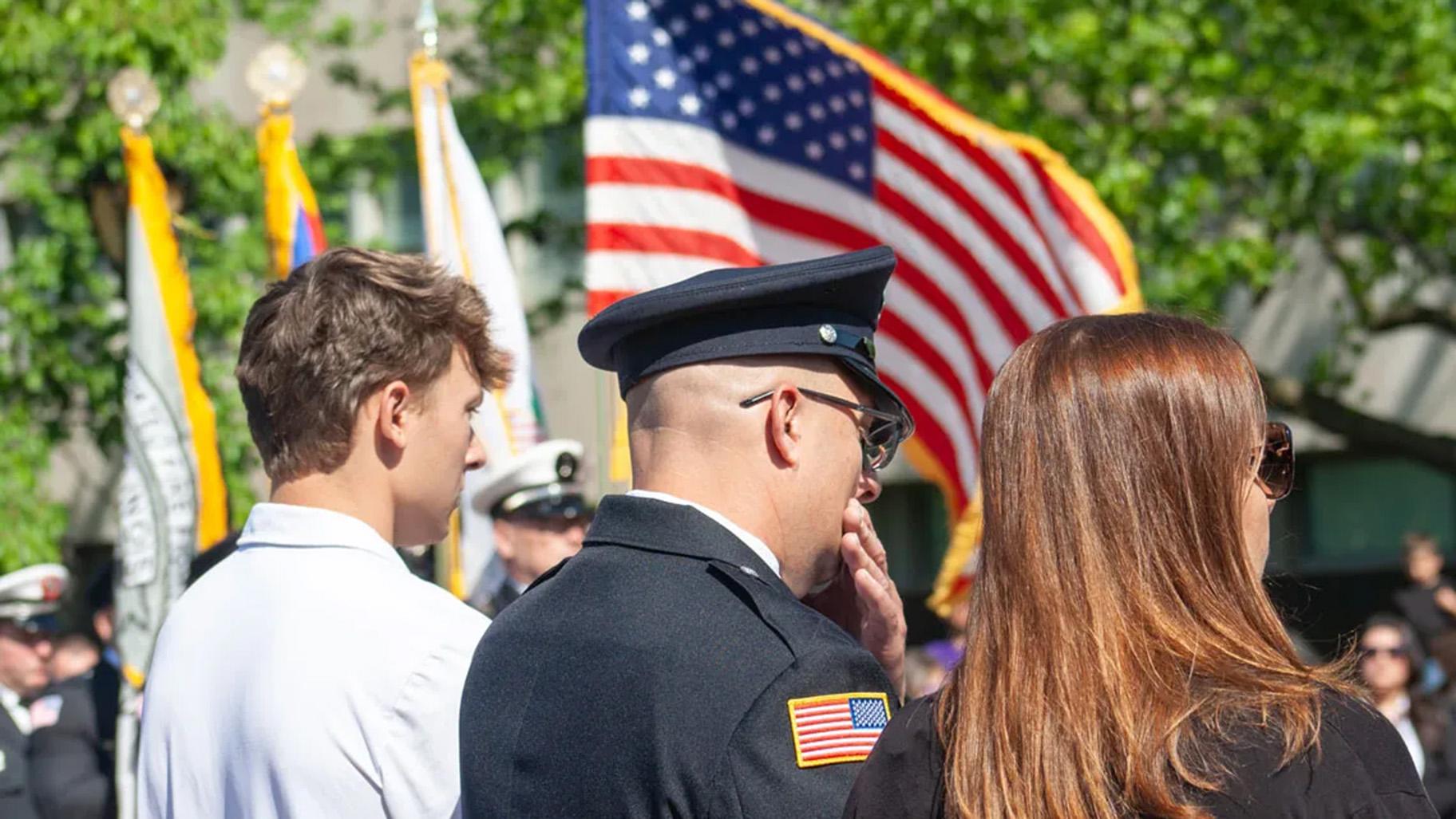 Attendees listen to speeches at the annual firefighter memorial ceremony on May 12, 2026. (Jenna Schweikert / Capitol News Illinois)