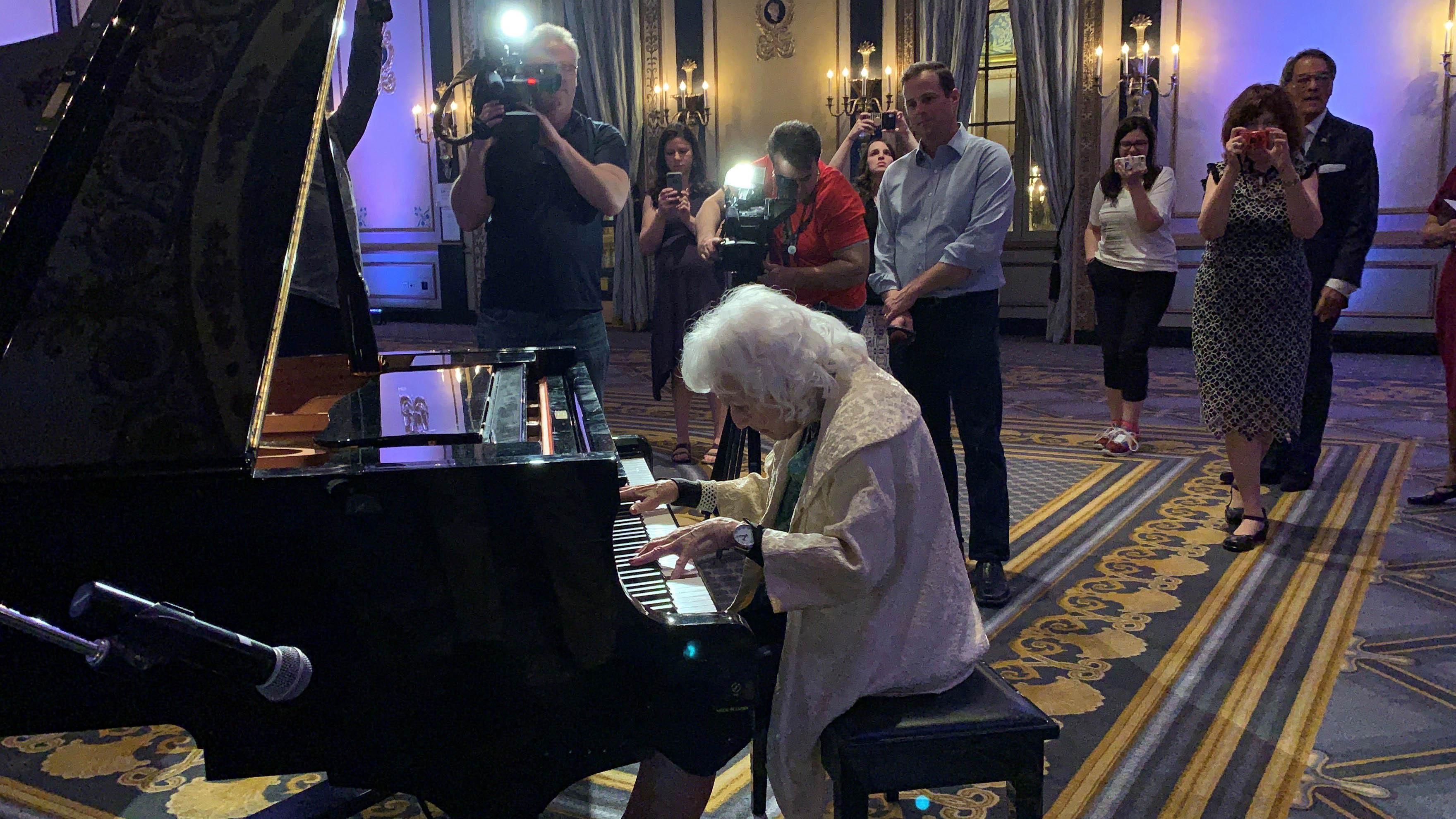 Dorothy Olson Pauletti, back at the piano in the Empire Room.