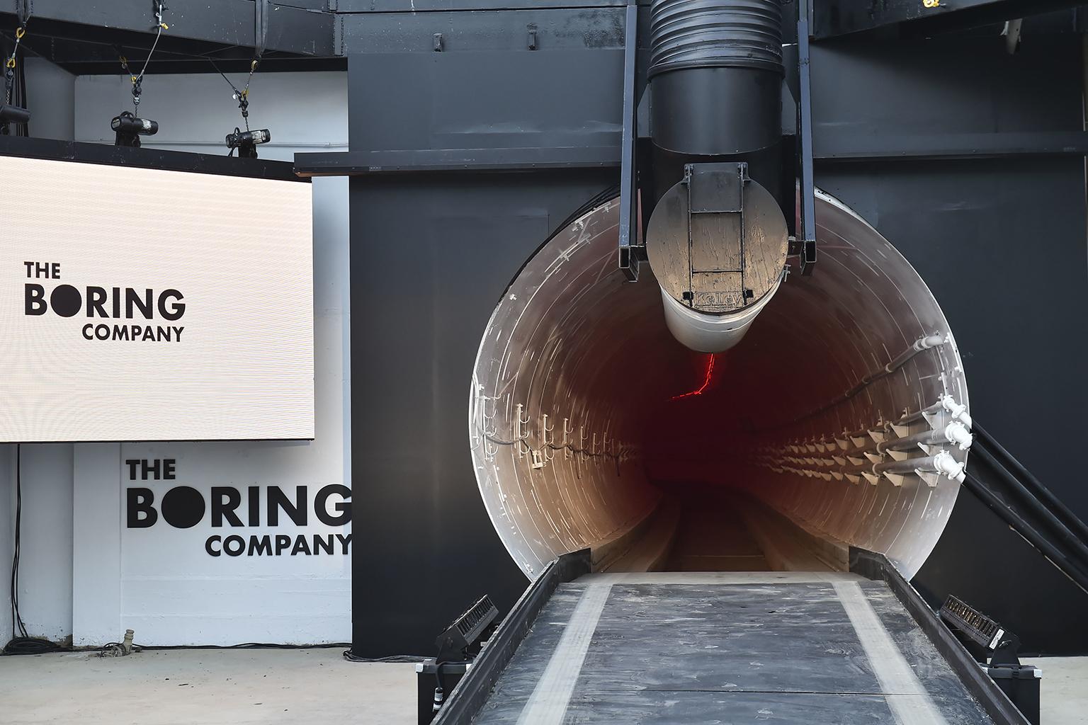 The Boring Company signage is displayed Tuesday, Dec. 18, 2018 at the tunnel entrance before an unveiling event for the Boring Co. Hawthorne test tunnel in Hawthorne, Calif. (Robyn Beck / Pool Photo via AP)