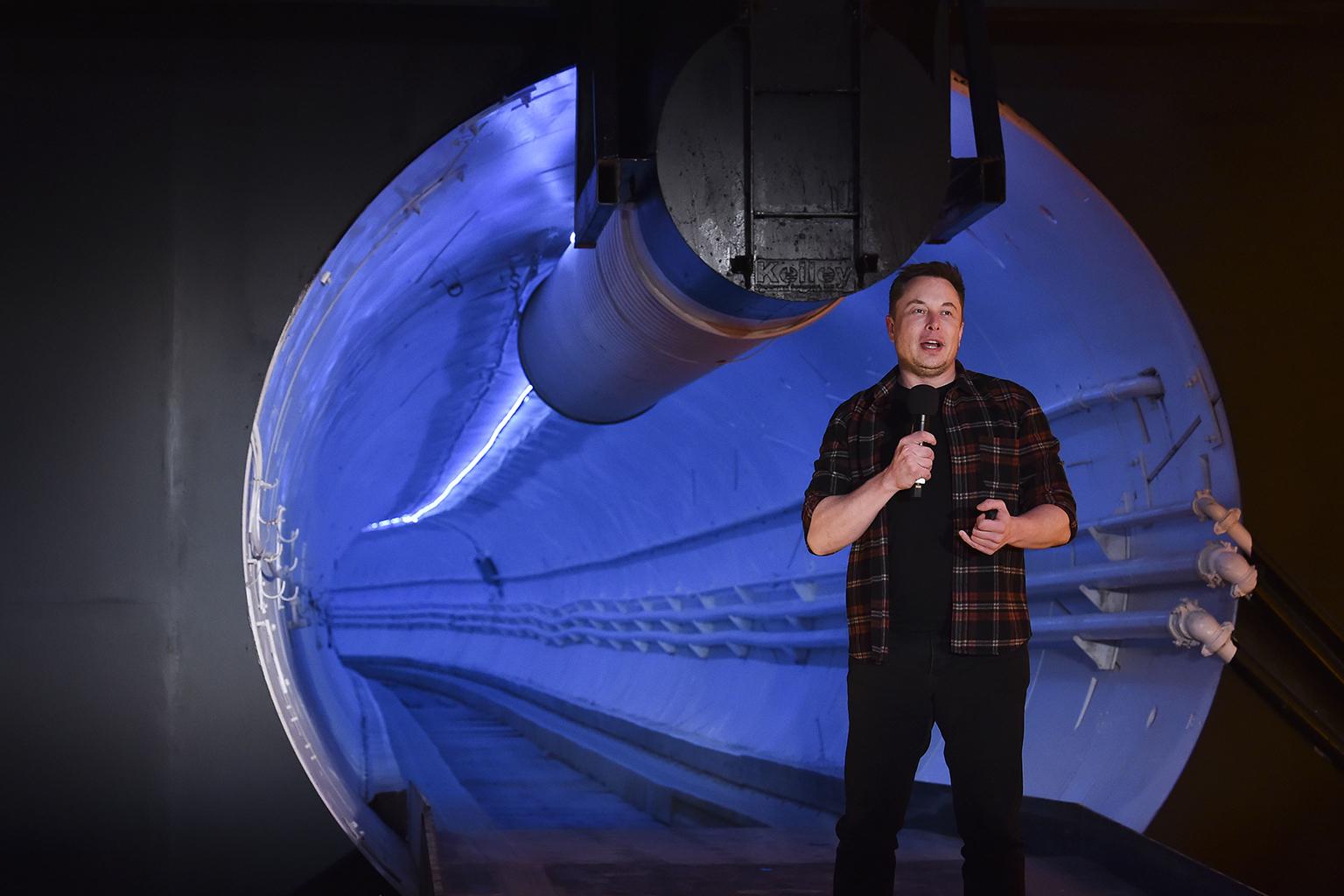 Elon Musk, co-founder and chief executive officer of Tesla Inc., speaks Tuesday, Dec. 18, 2018 during an unveiling event for the Boring Co. Hawthorne test tunnel in Hawthorne, Calif. (Robyn Beck / Pool Photo via AP)