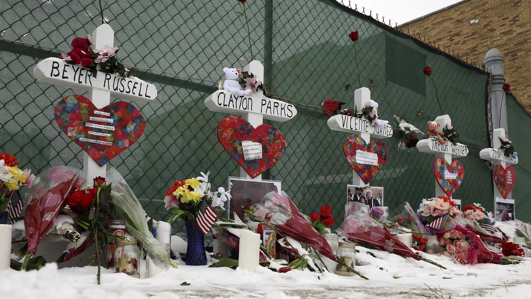 Crosses are placed for the victims of a mass shooting Sunday, Feb. 17, 2019, in Aurora, near Henry Pratt Co. manufacturing company where several were killed on Friday. (AP Photo / Nam Y. Huh)