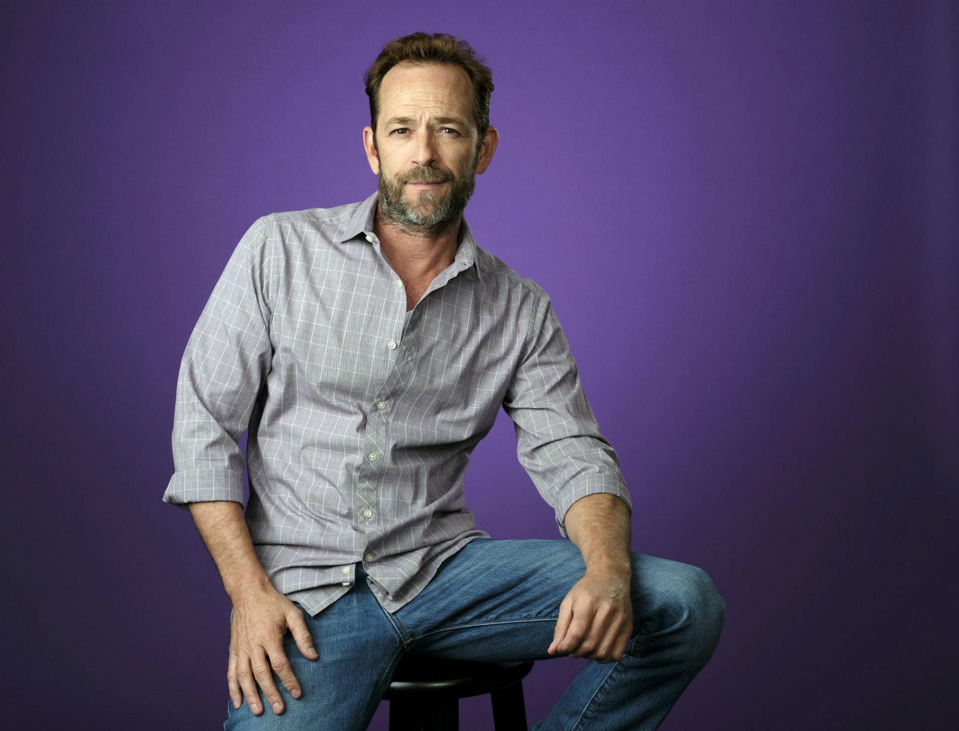 In this Aug. 6, 2018, file photo, Luke Perry poses for a portrait during the 2018 Television Critics Association Summer Press Tour in Beverly Hills, California. (Photo by Chris Pizzello / Invision /AP, File)