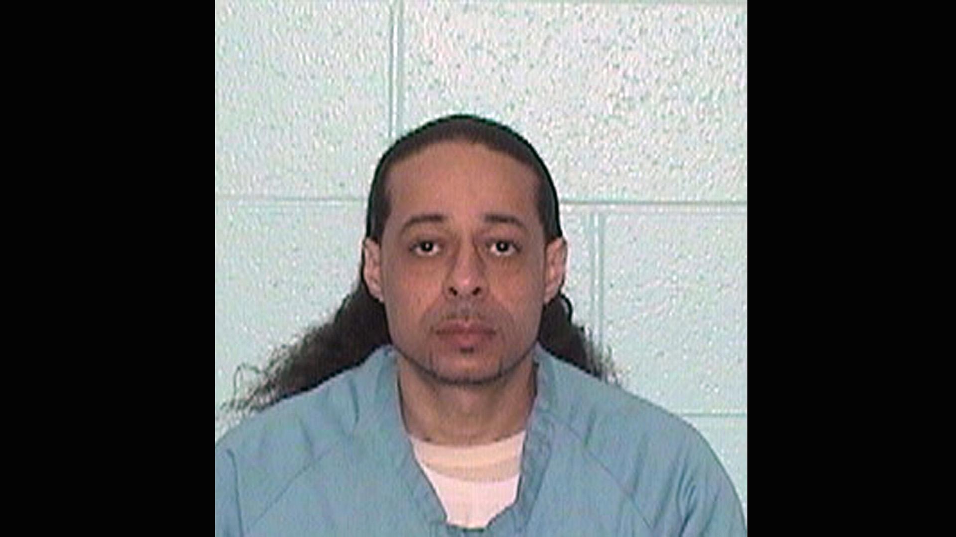 This undated booking photo released by Illinois Department of Corrections shows Floyd E. Brown. Illinois State Police say Brown, 39, suspected of shooting a sheriff's deputy and a woman Thursday, March 7, 2019 at an Illinois hotel crashed his vehicle along an interstate highway while trying to flee police. (Illinois Department of Corrections via AP)