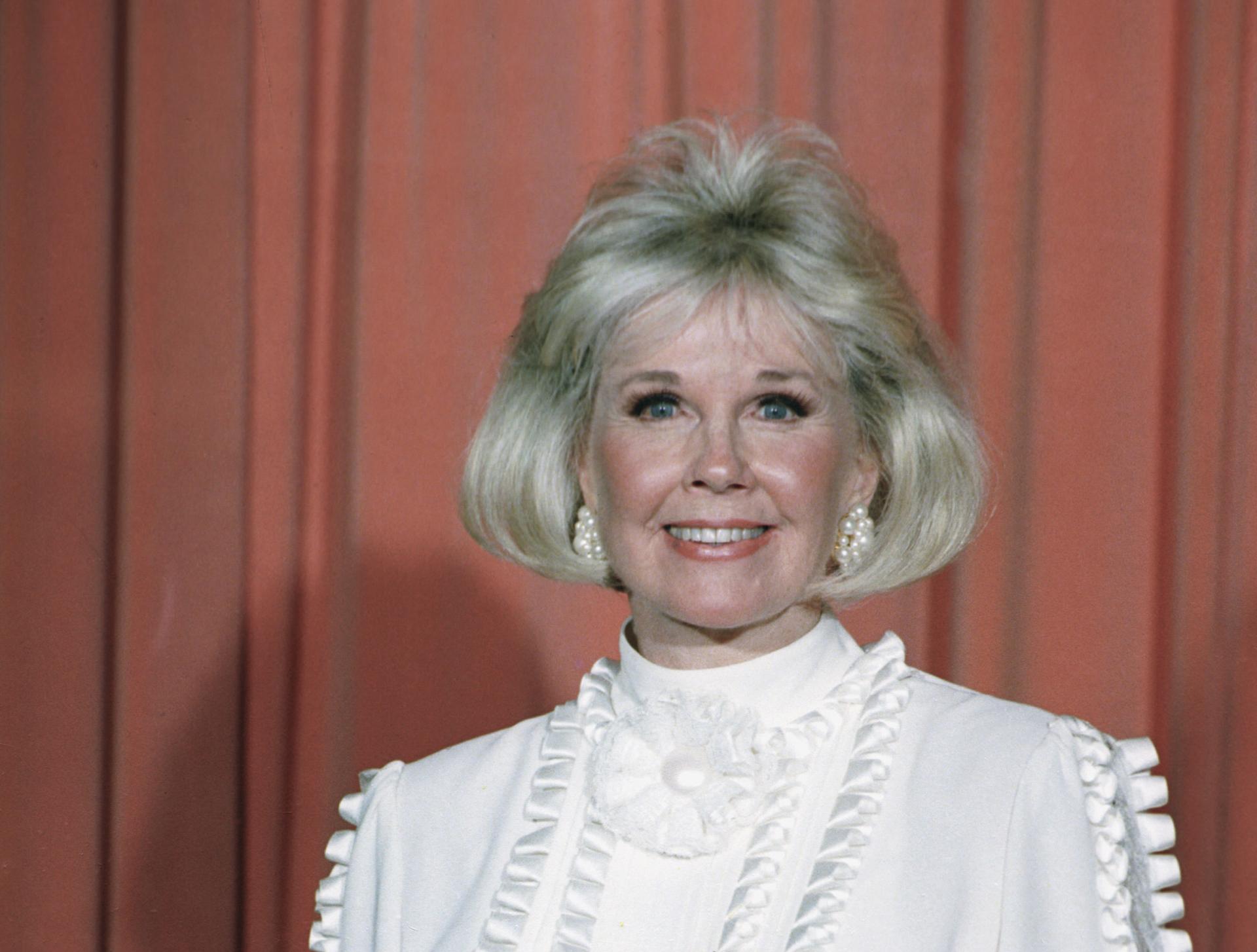 In this Jan. 28, 1989 file photo, actress and animal rights activist Doris Day poses for photos after receiving the Cecil B. DeMille Award she was presented with at the annual Golden Globe Awards ceremony in Los Angeles. (AP Photo, File)