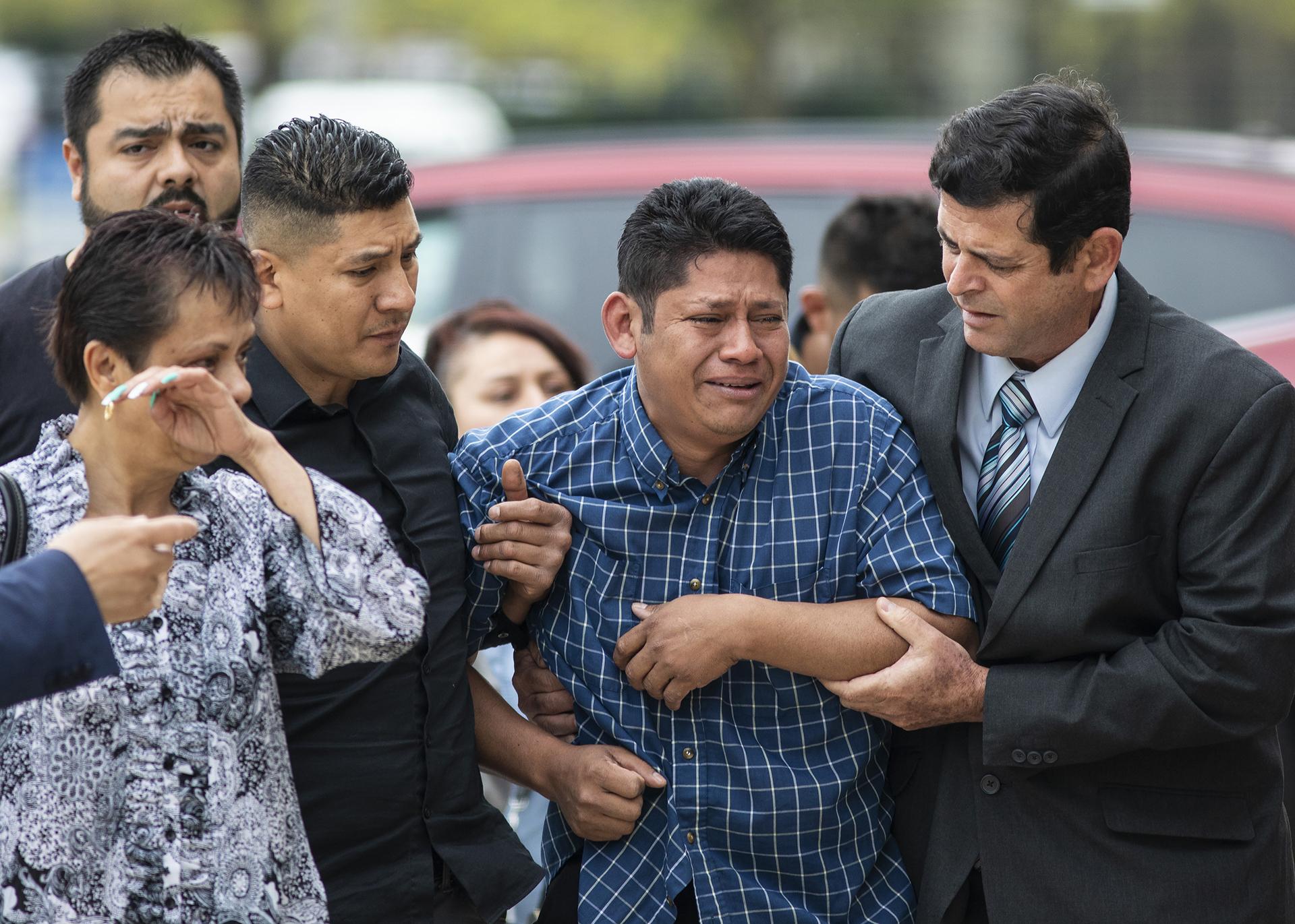 Arnulfo Ochoa, the father of Marlen Ochoa-Lopez, is surrounded by family members and supporters, as he walks into the Cook County medical examiner’s office to identify his daughter’s body, Thursday, May 16, 2019 in Chicago. (Ashlee Rezin / Chicago Sun-Times via AP)