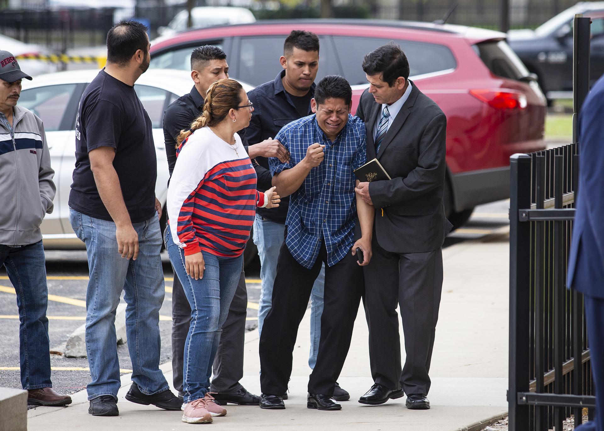 Arnulfo Ochoa, the father of Marlen Ochoa-Lopez, is surrounded by family members and supporters, as he walks into the Cook County medical examiner’s office to identify his daughter’s body, Thursday, May 16, 2019 in Chicago. (Ashlee Rezin / Chicago Sun-Times via AP)