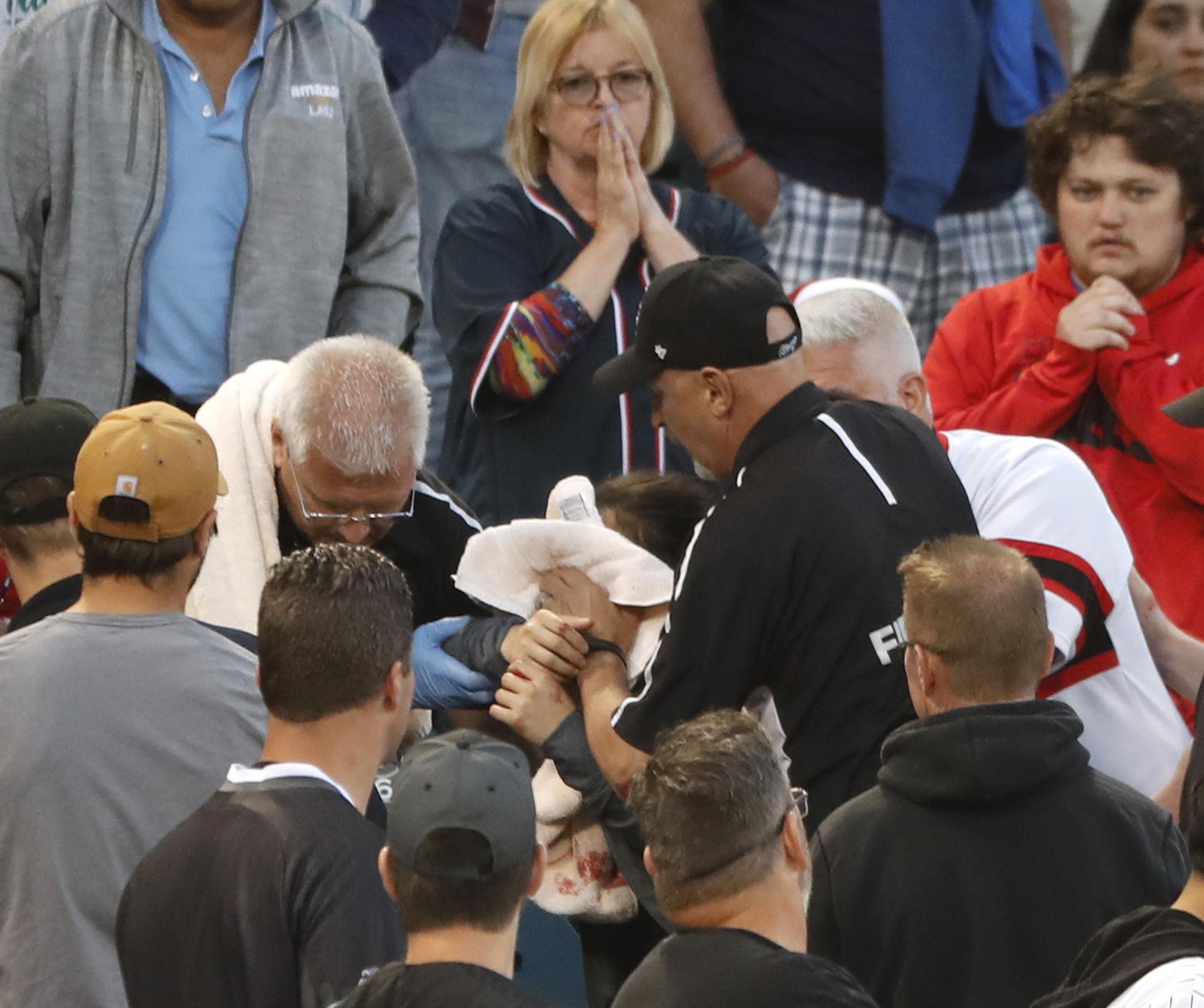In this Monday, June 10, 2019, file photo, Emergency personal keep a towel on the face of a person who was struck by a line drive by Chicago White Sox’s Eloy Jimenez during the fourth inning of a baseball game against the Washington Nationals in Chicago. (AP Photo / Charles Rex Arbogast, File)