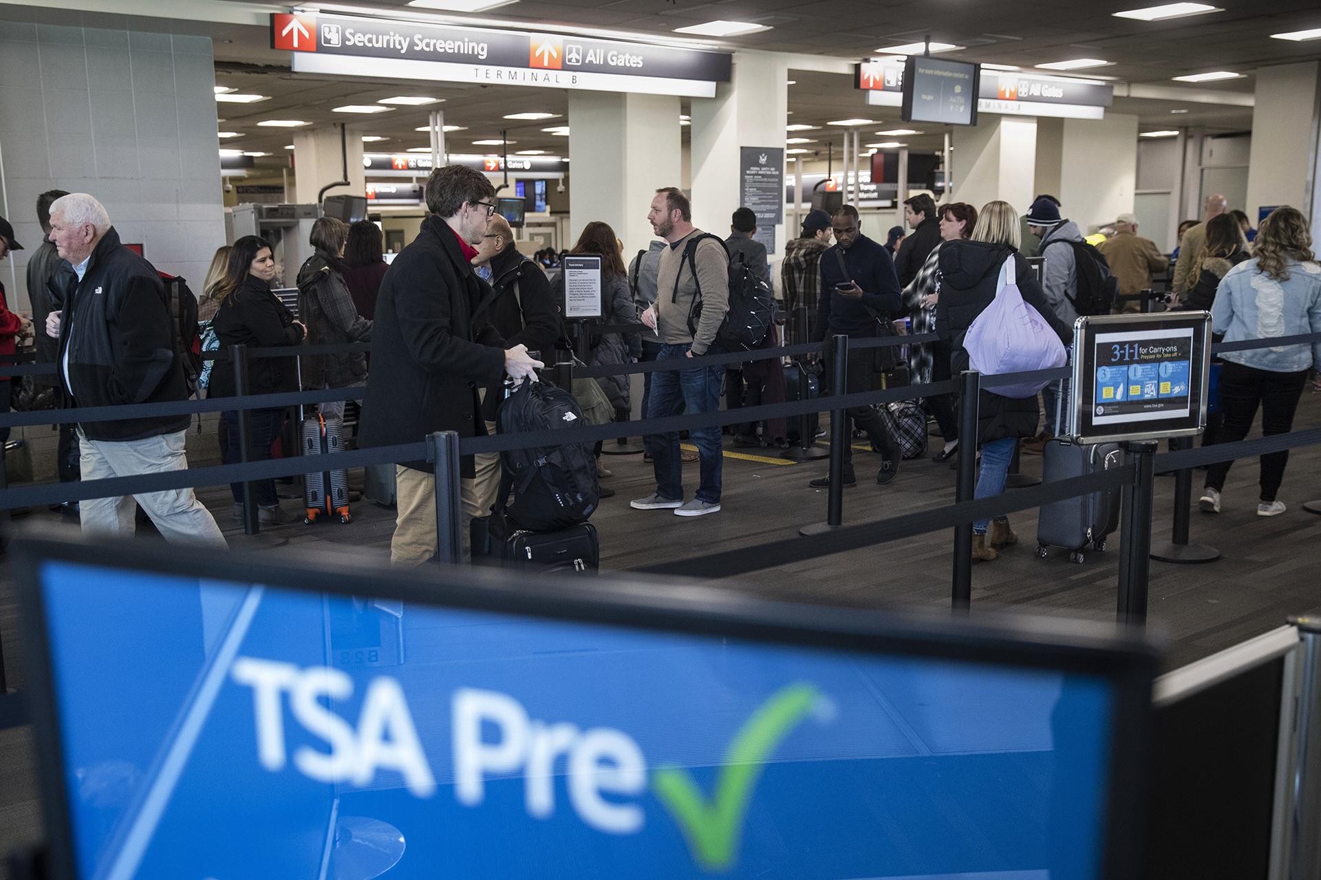 In this Jan. 11, 2019, file photo, passengers wait in line at a Transportation Security Administration checkpoint at the Philadelphia International Airport in Philadelphia. (AP Photo / Matt Rourke, File)