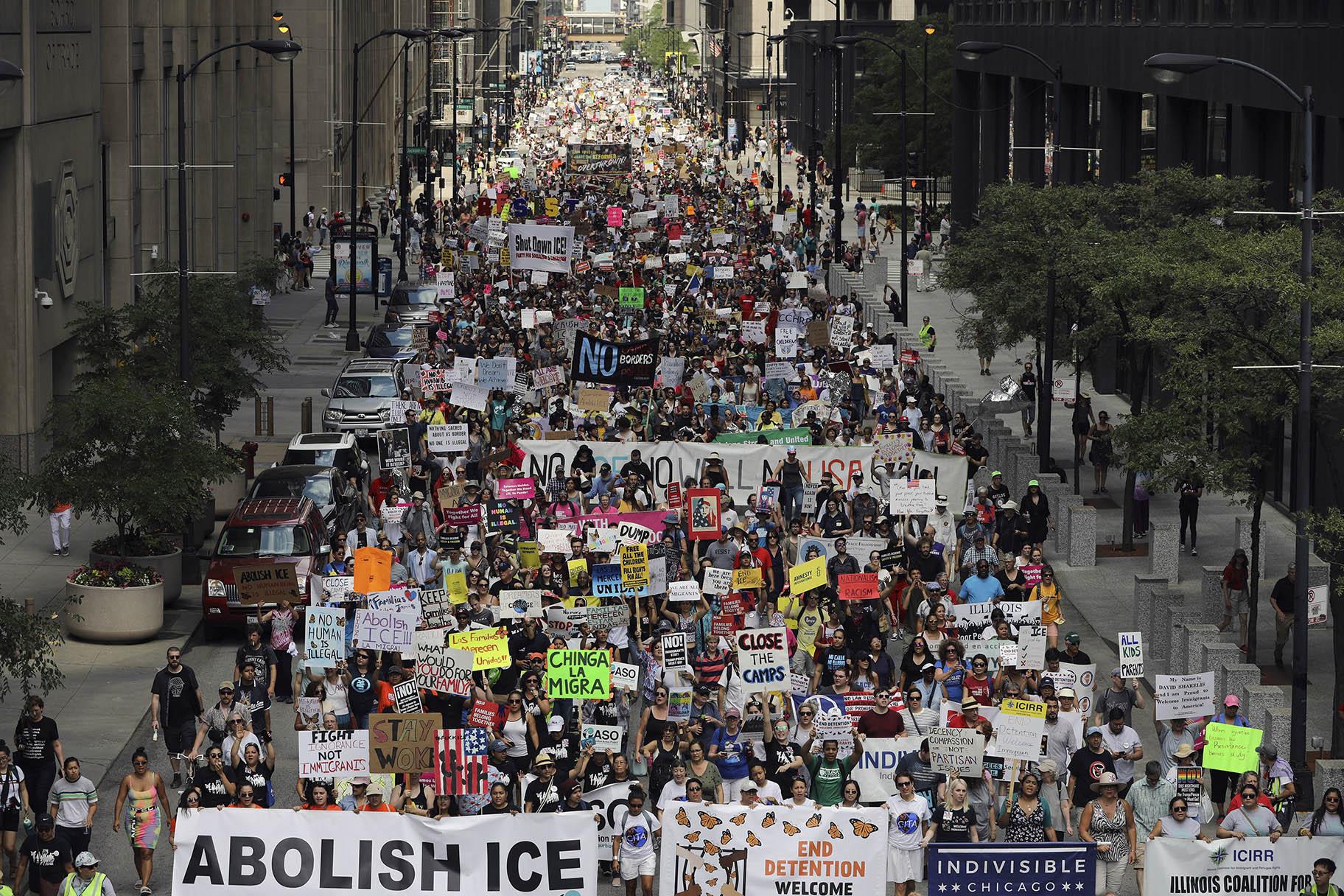 Thousands of people, including immigrants and their supporters, rally against President Donald Trump’s immigration policies as they march from Daley Plaza to the Chicago field office of Immigration and Customs Enforcement, Saturday, July 13, 2019, in Chicago. (Abel Uribe / Chicago Tribune via AP)