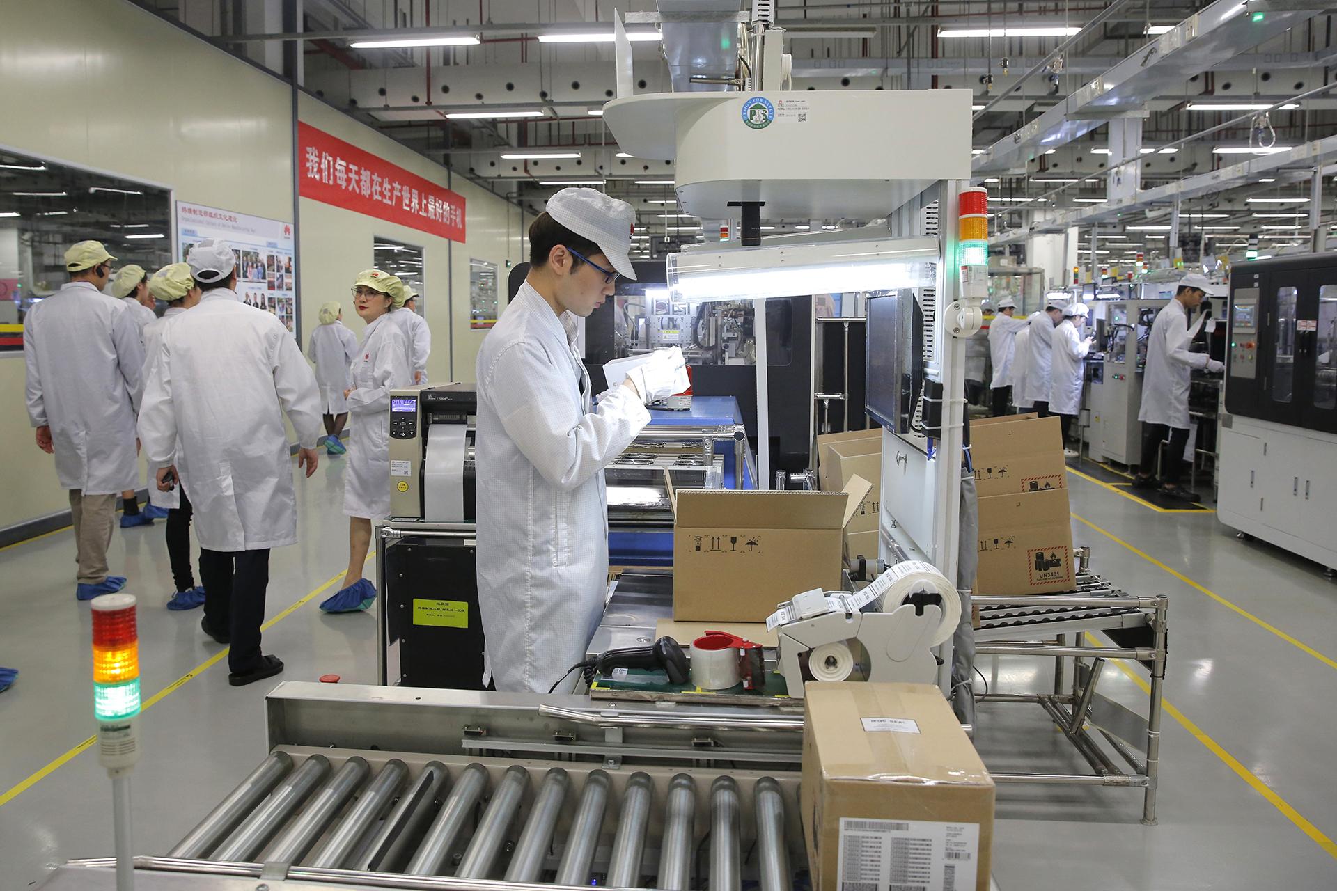  In this March 6, 2019, file photo a staff member works on a mobile phone production line during a media tour in Huawei factory in Dongguan, China’s Guangdong province. Huawei Technologies Co. is one of the world’s biggest supplier of telecommunications equipment. (AP Photo / Kin Cheung, File)