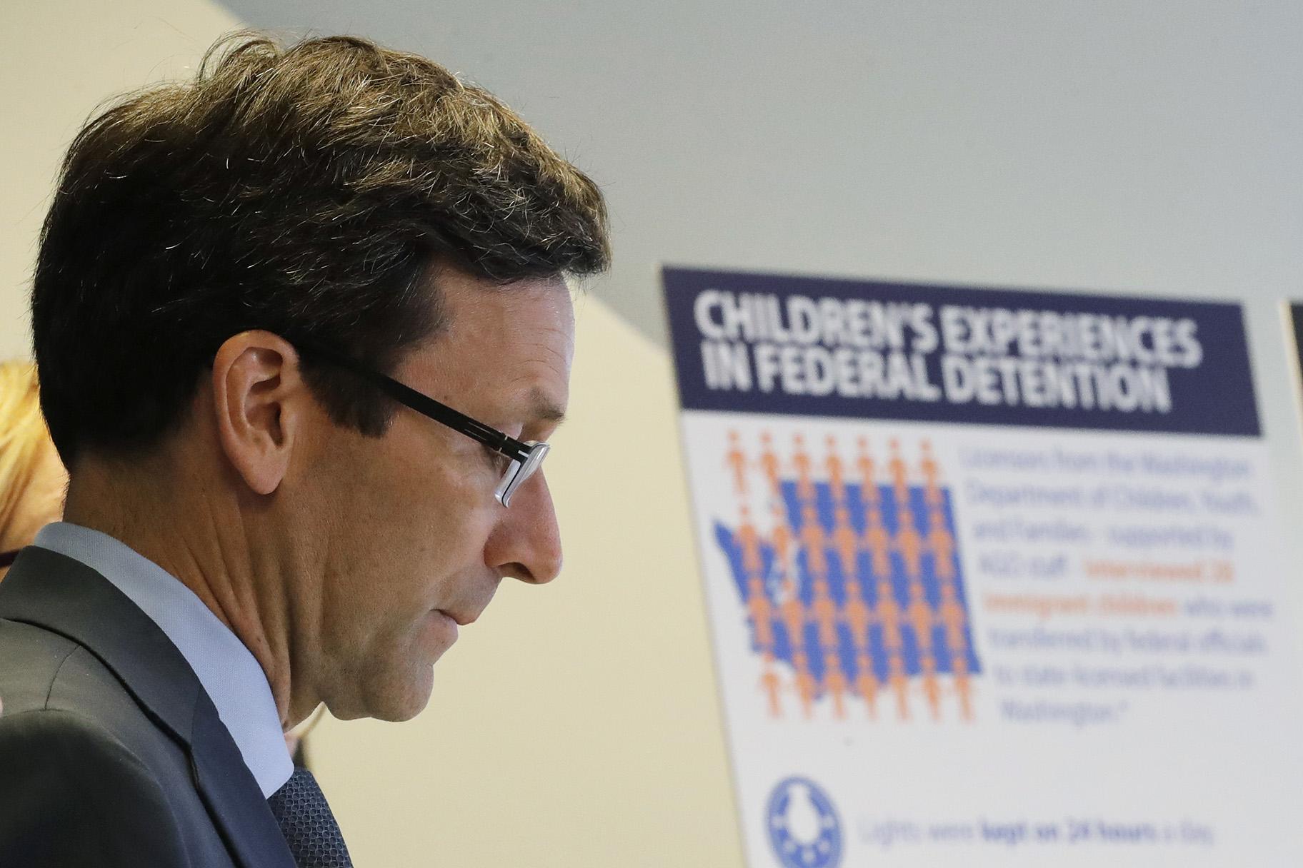 Washington Attorney General Bob Ferguson listens to a question as he stands next to a display board, Monday, Aug. 26, 2019, during a news conference in Seattle. (AP Photo / Ted S. Warren)