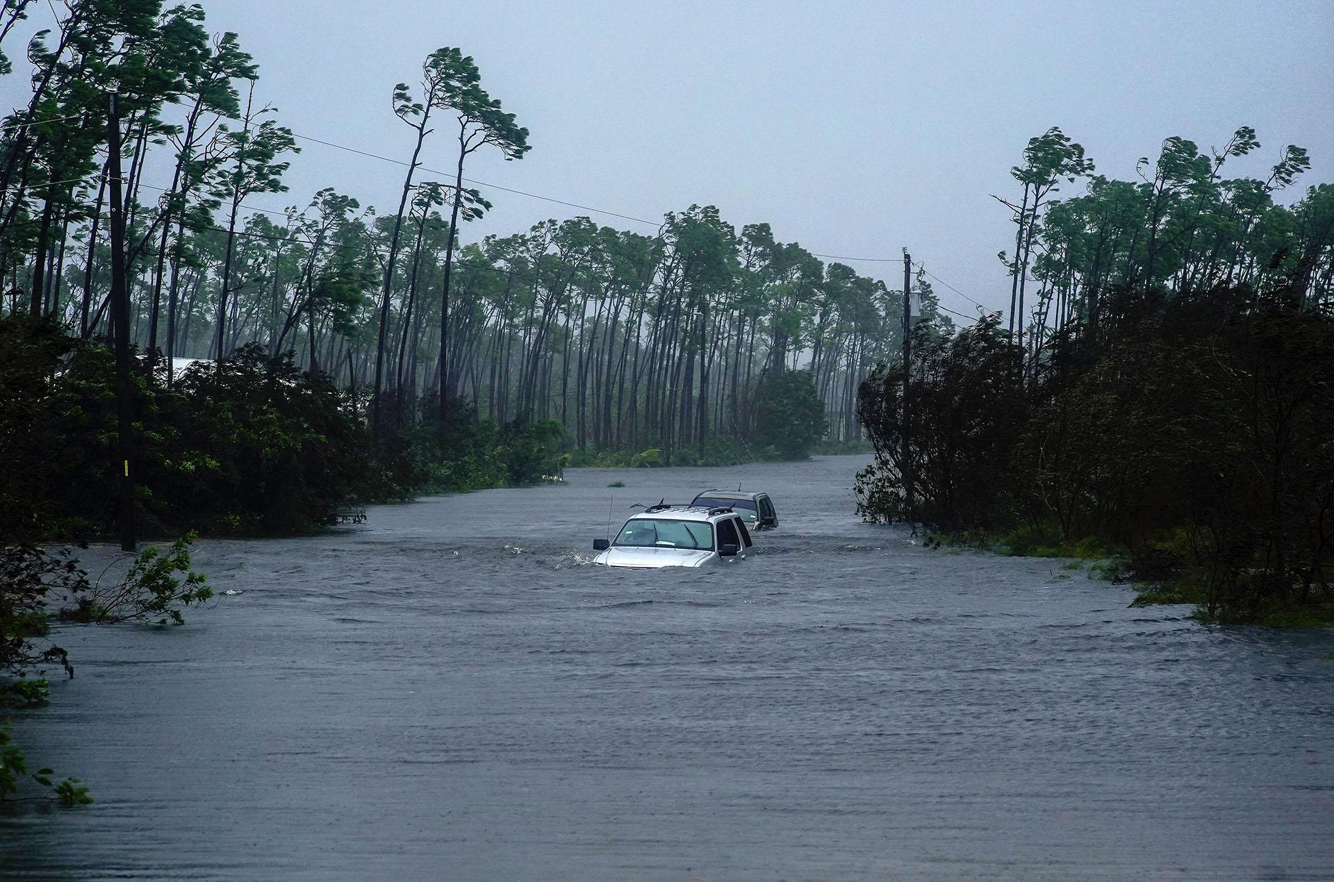 Cars sit submerged in water from Hurricane Dorian in Freeport, Bahamas, Tuesday, Sept. 3, 2019. AP Photo / Ramon Espinosa)