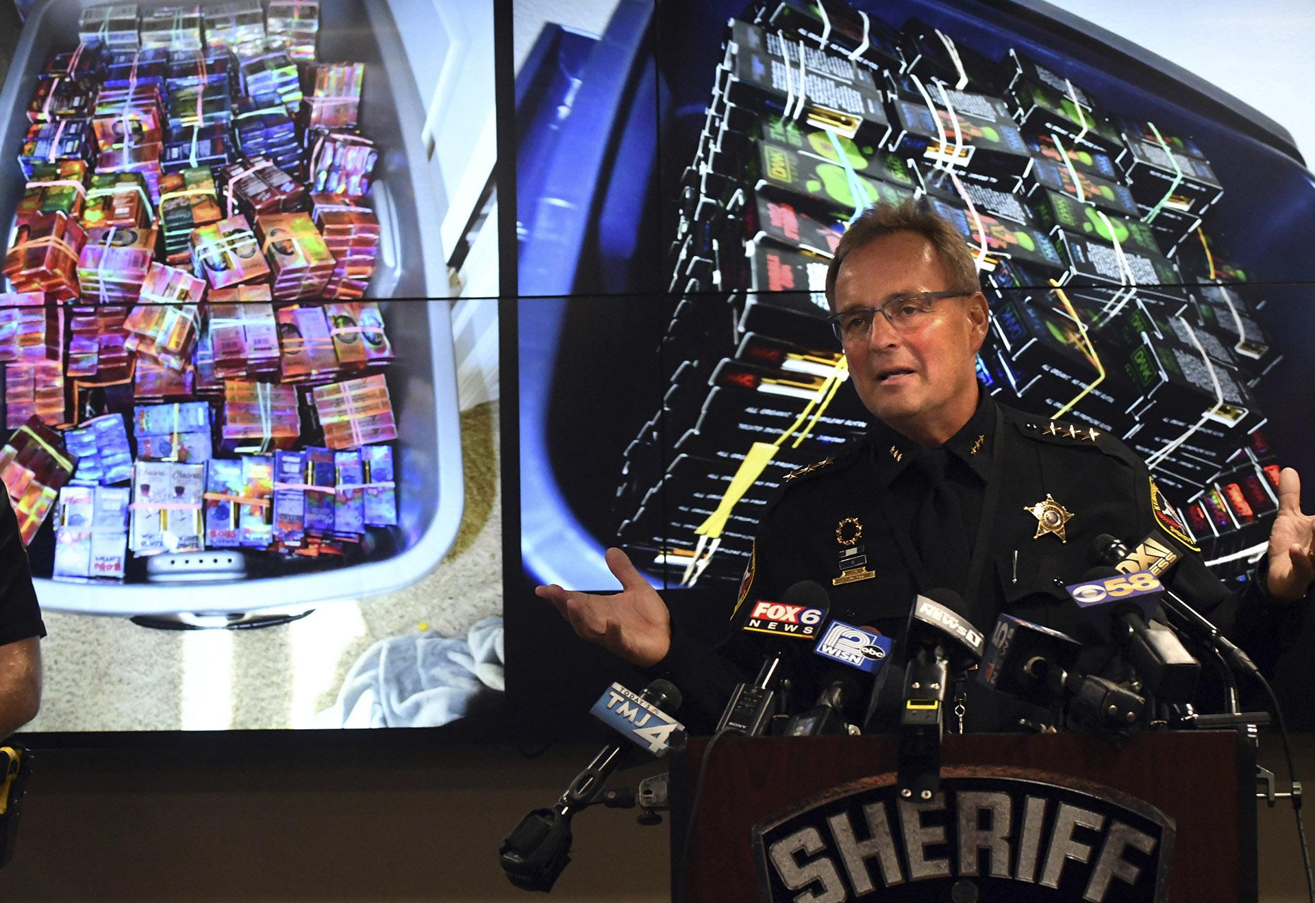 Kenosha County Sheriff David Beth talks about the THC-infused vaping cartridges that were part of a large-scale marijuana operation during a news conference in Kenosha Wednesday, Sept. 11, 2019. (Paul Williams / The Kenosha News via AP)