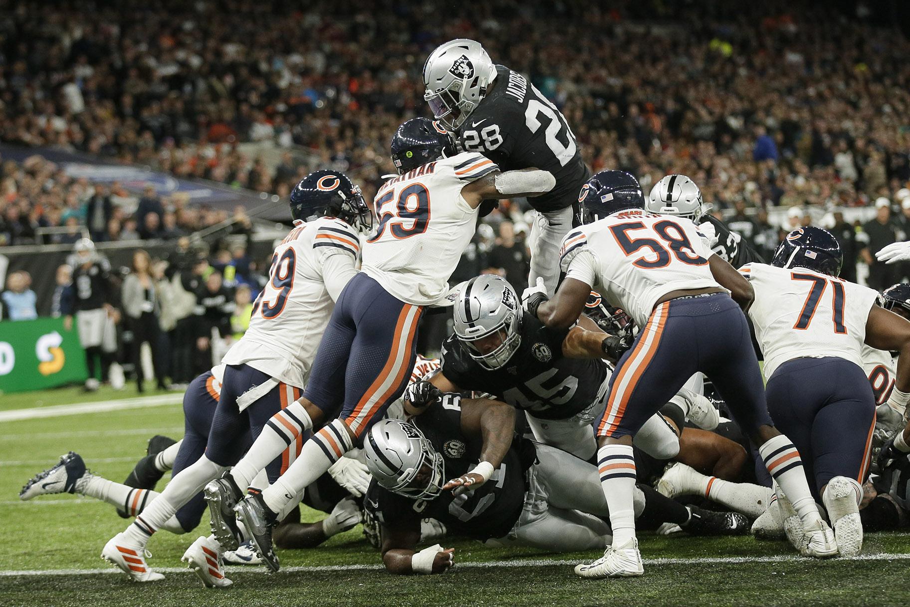 Oakland Raiders running back Josh Jacobs (28) goes in for a touchdown during the second half of an NFL football game against the Chicago Bears at Tottenham Hotspur Stadium, Sunday, Oct. 6, 2019, in London. (AP Photo / Tim Ireland)