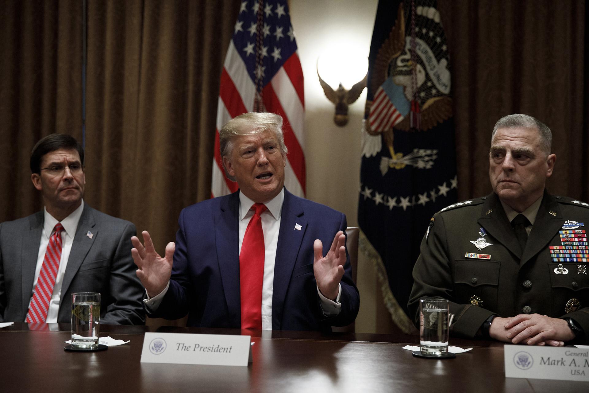 President Donald Trump, joined by from left, Defense Secretary Mark Esper, and Chairman of the Joint Chiefs of Staff Gen. Mark Milley, speaks to media during a briefing with senior military leaders in the Cabinet Room at the White House in Washington, Monday, Oct. 7, 2019. (AP Photo / Carolyn Kaster)