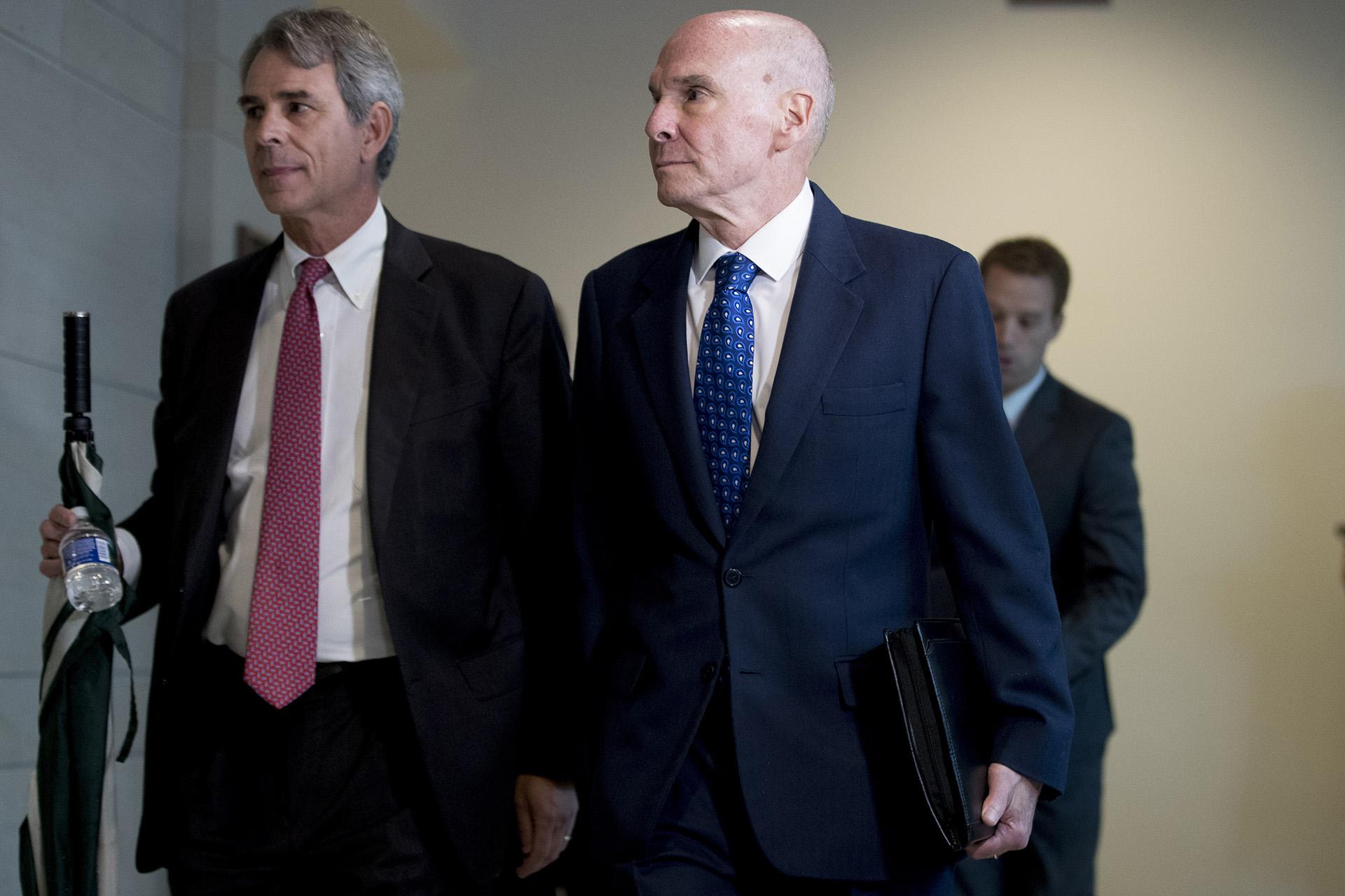 Michael McKinley, a former top aide to Secretary of State Mike Pompeo, right, arrives on Capitol Hill in Washington, Wednesday, Oct. 16, 2019, to testify before congressional lawmakers as part of the House impeachment inquiry into President Donald Trump. (AP Photo / Andrew Harnik)