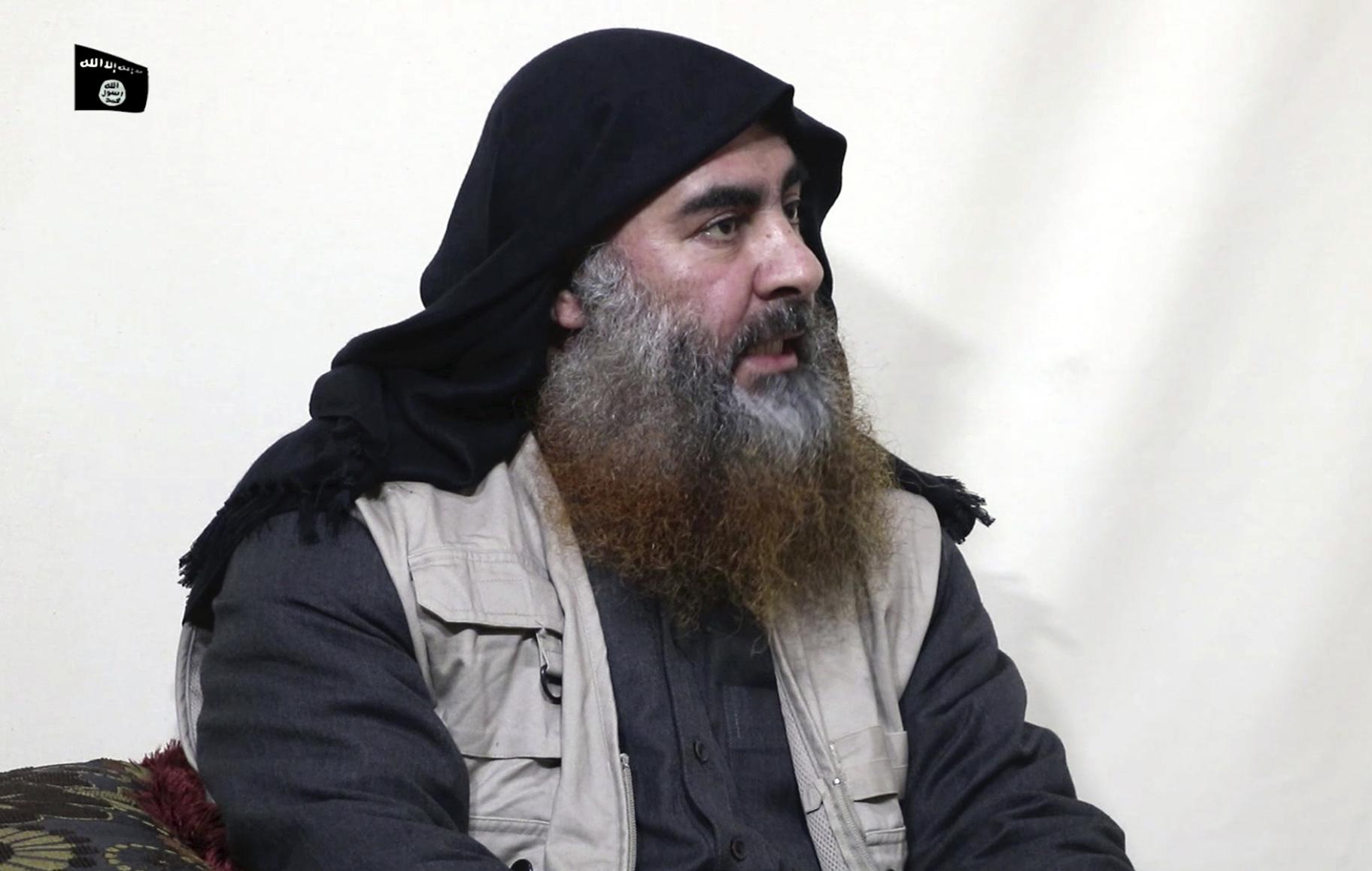 This file image made from video posted on a militant website April 29, 2019, purports to show the leader of the Islamic State group, Abu Bakr al-Baghdadi, being interviewed by his group’s Al-Furqan media outlet. (Al-Furqan media via AP, File)