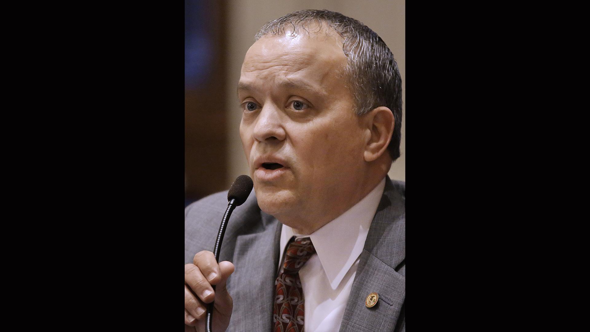 In this April 16, 2013 file photo, Illinois Rep. Luis Arroyo, D-Chicago, speaks on the House floor during session in Springfield, Illinois. (AP Photo / Seth Perlman)