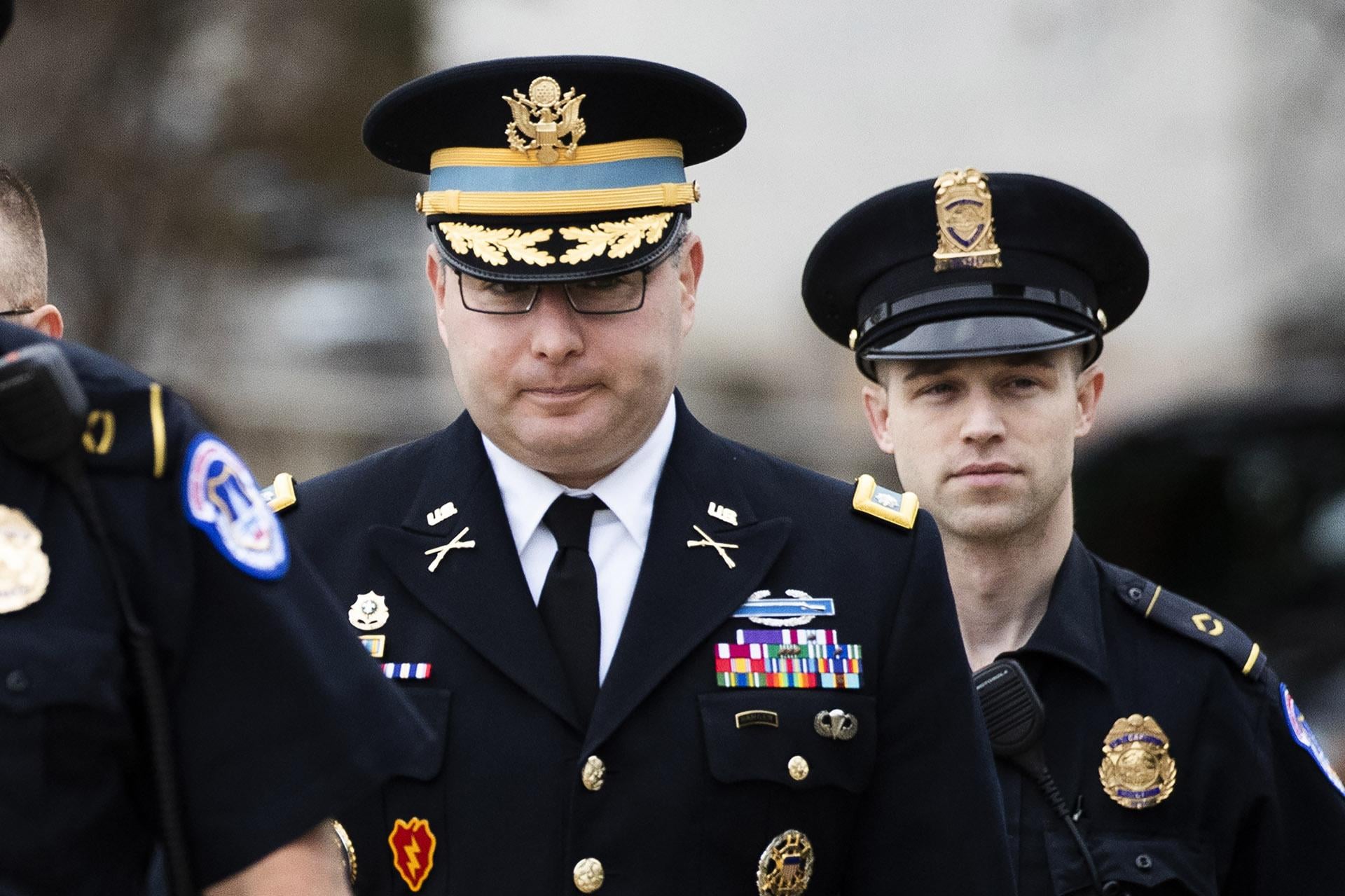 Army Lieutenant Colonel Alexander Vindman, a military officer at the National Security Council, center, arrives on Capitol Hill in Washington, Tuesday, Oct. 29, 2019, to appear before a House Committee on Foreign Affairs, Permanent Select Committee on Intelligence, and Committee on Oversight and Reform joint interview with the transcript to be part of the impeachment inquiry into President Donald Trump. (AP Photo / Manuel Balce Ceneta)