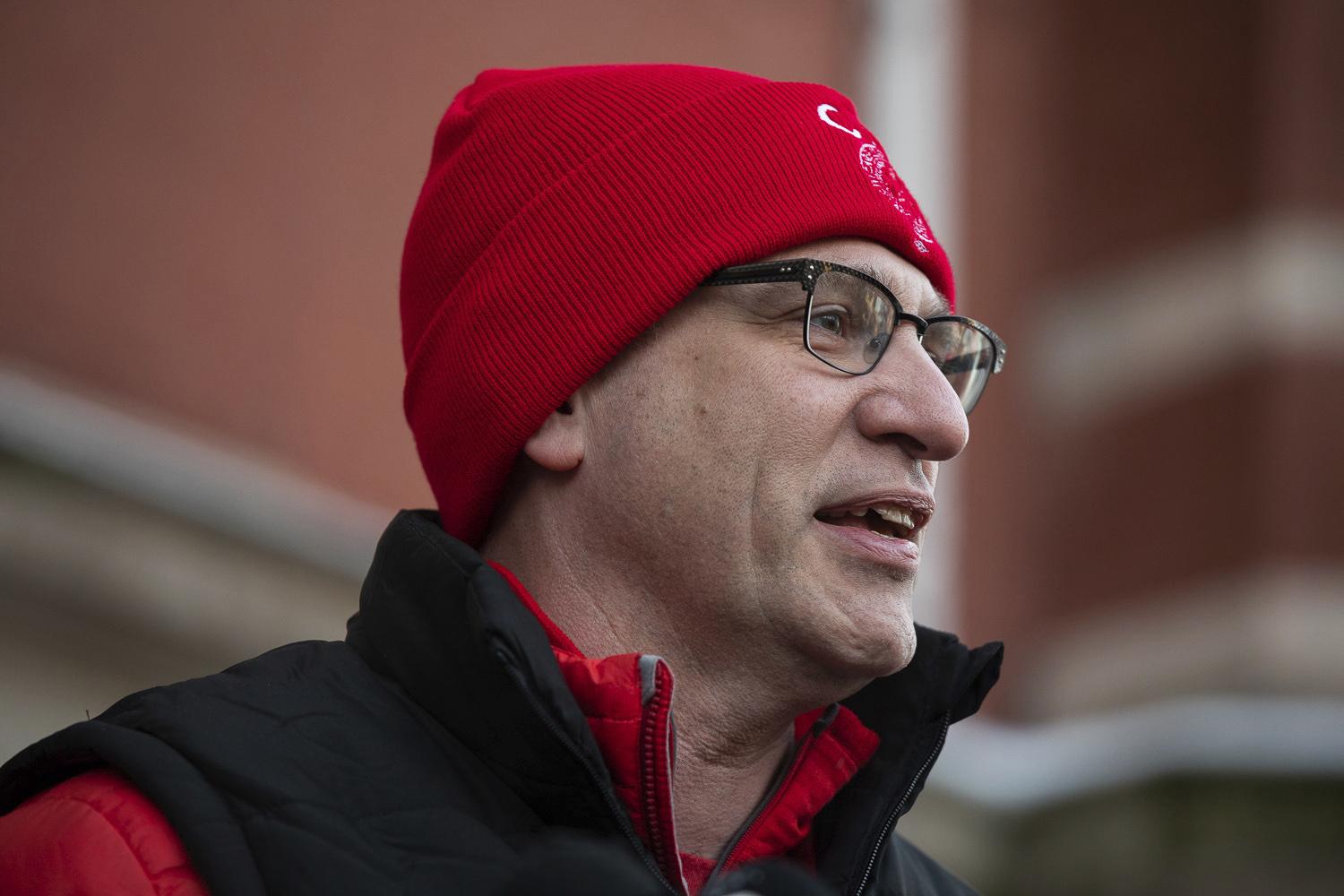 After a teachers strike that lasted more than two weeks, Chicago Teachers Union President Jesse Sharkey delivers a statement in front of Richard Yates Elementary School in Humboldt Park on the first day back to school, Friday morning, Nov. 1, 2019. (Pat Nabong / Chicago Sun-Times via AP)