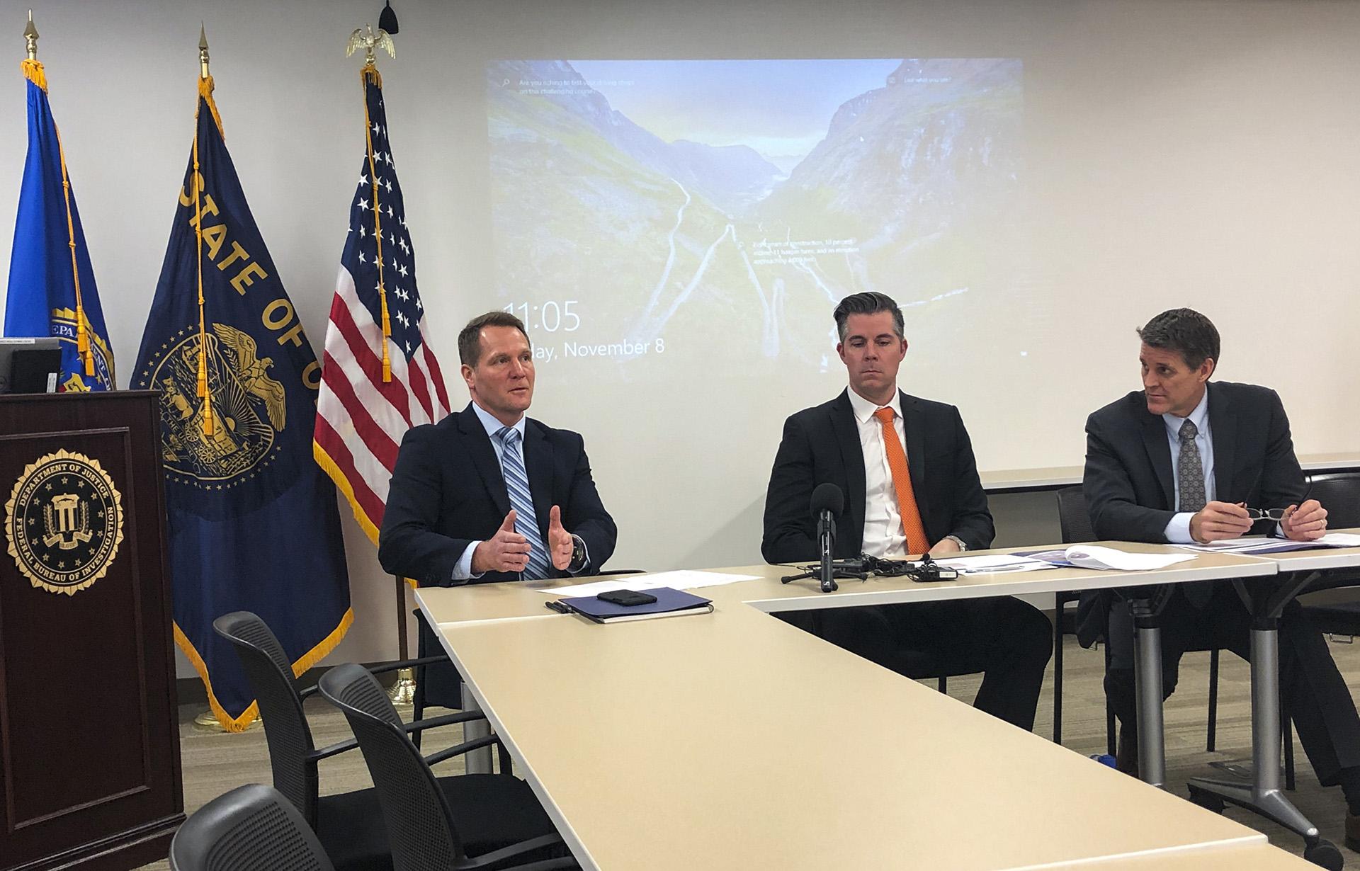 In this Friday, Nov. 8, 2019, photo, FBI Assistant Special Agent in Charge George Chamberlin, from left, speaks as Gabriel Gundersen, an FBI supervisory special agent with the Oregon Cyber Task Force, center, and Loren Cannon, FBI special agent in charge of the Portland Division, in Portland, Oregon to reporters about the rise of cybercrime in Oregon. (AP Photo / Andrew Selsky)
