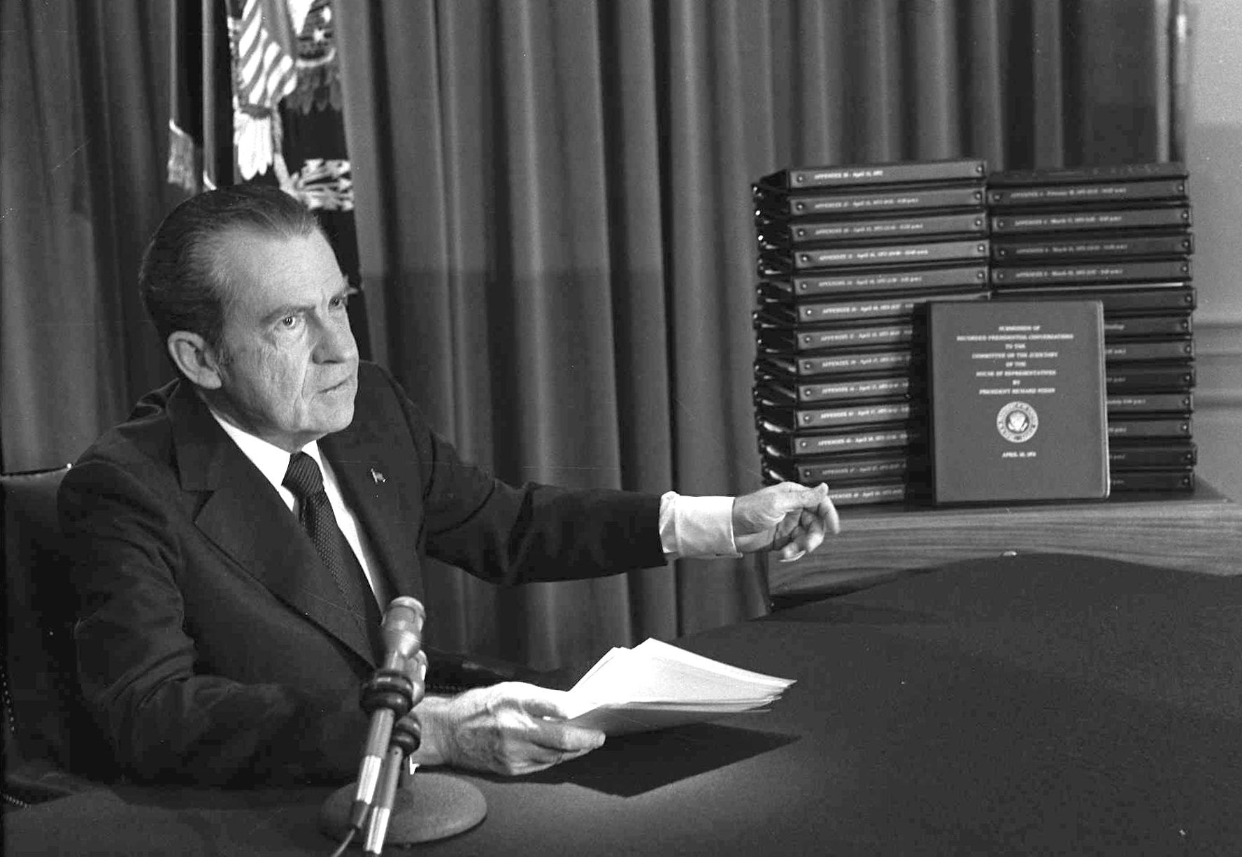 In this April 29, 1974 file photo, President Richard M. Nixon points to the transcripts of the White House tapes in Washington, after he announced on television that he would turn over the transcripts to House impeachment investigators. (AP Photo / File)