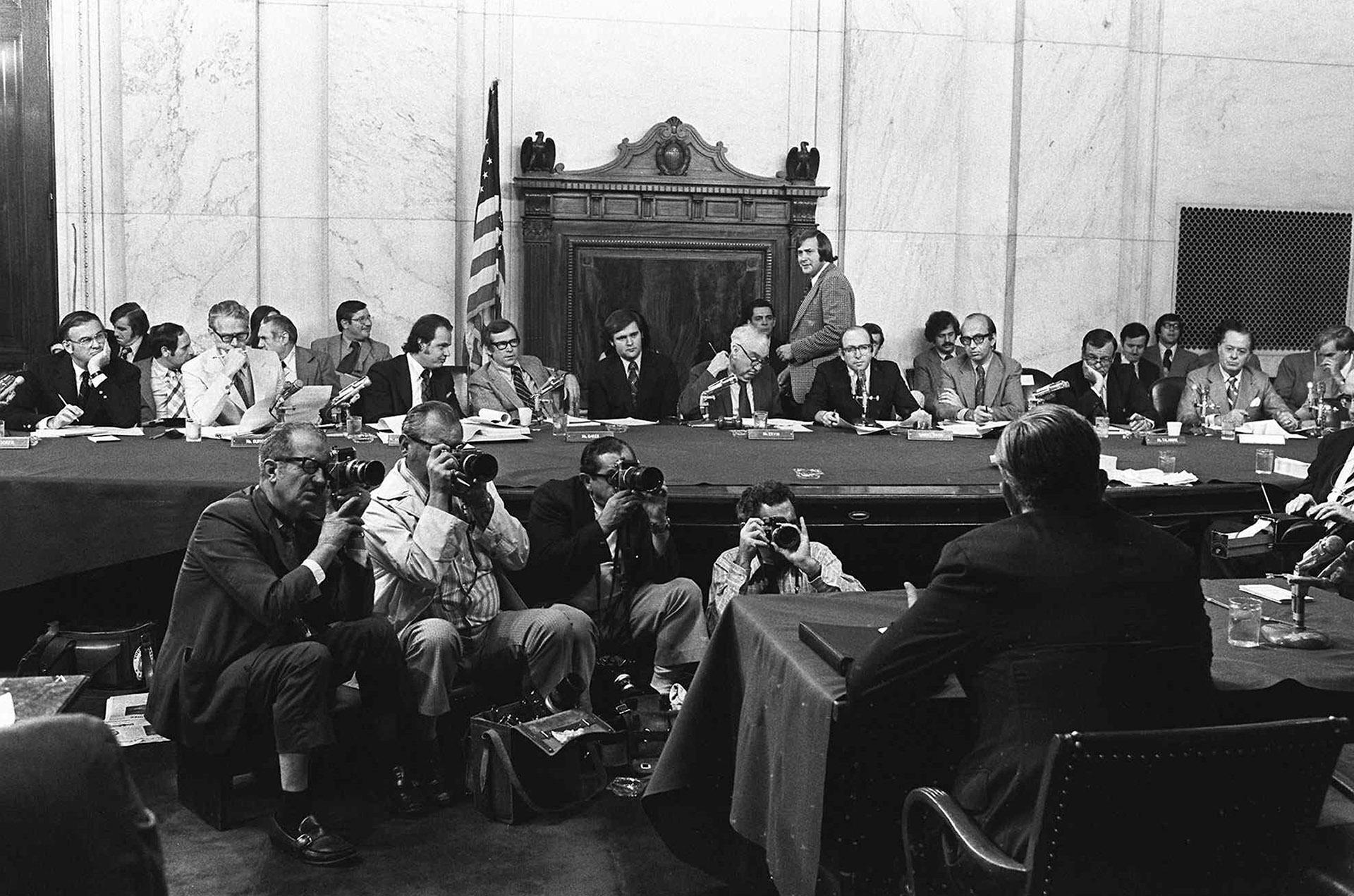 In this Aug. 3, 1973, file photo, the Senate Watergate Committee hearings continue on Capitol Hill in Washington. From left are: Sen. Lowell P. Weicker, Jr; Sen. Edward J. Gurney, Fred Thompson, Sen. Howard H. Baker, Jr; Rufus Edmisten, Sen. Sam Ervin; Sam Dash, Sen. Joseph M. Montoya, Sen. Daniel K. Inouye was absent. Testifying is Lt. Gen. Vernon Walters. (AP Photo / File)