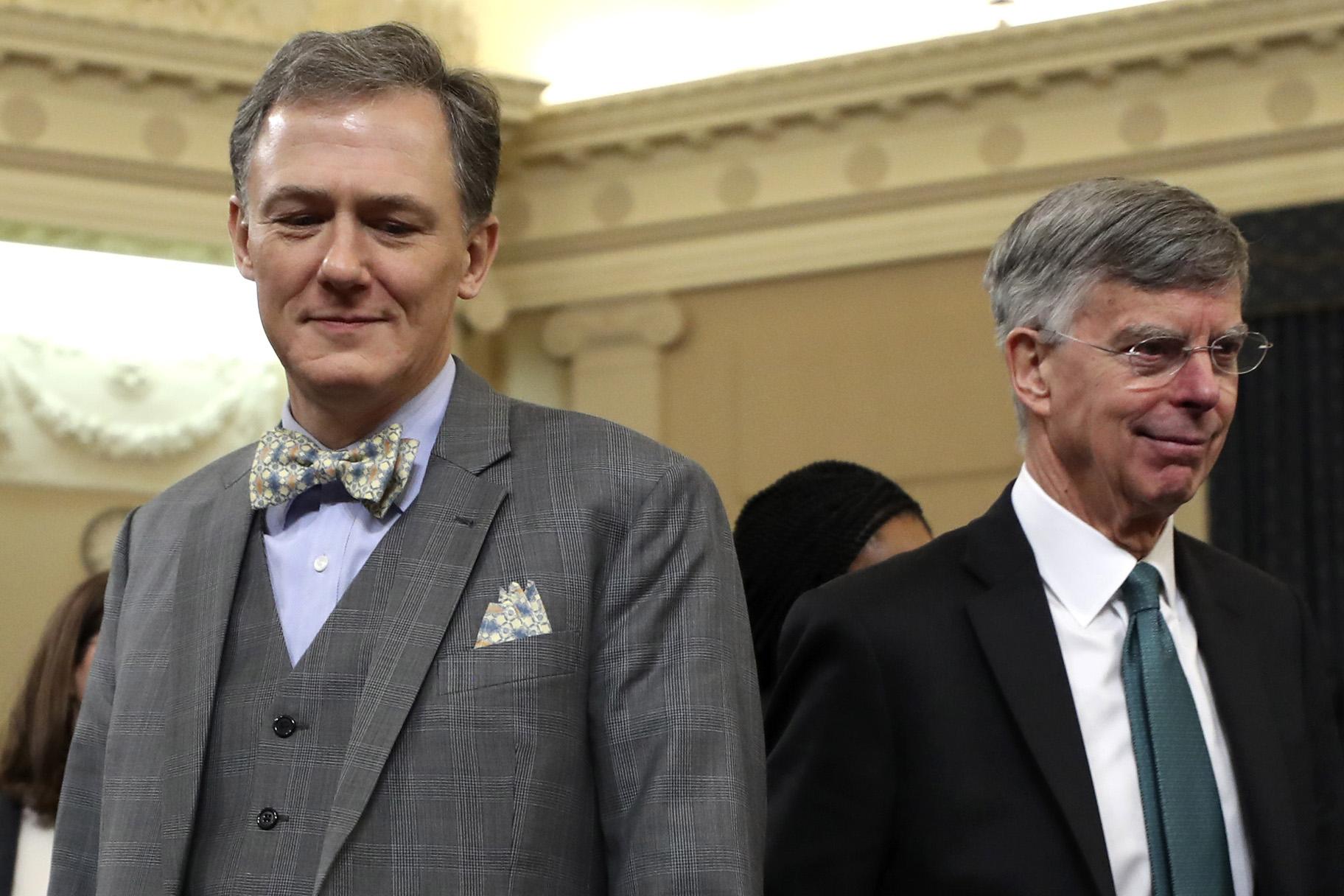 Top U.S. diplomat in Ukraine William Taylor, and career Foreign Service officer George Kent, left, walk back from a break as they testify before the House Intelligence Committee on Capitol Hill in Washington, Wednesday, Nov. 13, 2019, during the first public impeachment hearing of President Donald Trump’s efforts to tie U.S. aid for Ukraine to investigations of his political opponents. (AP Photo / Andrew Harnik)
