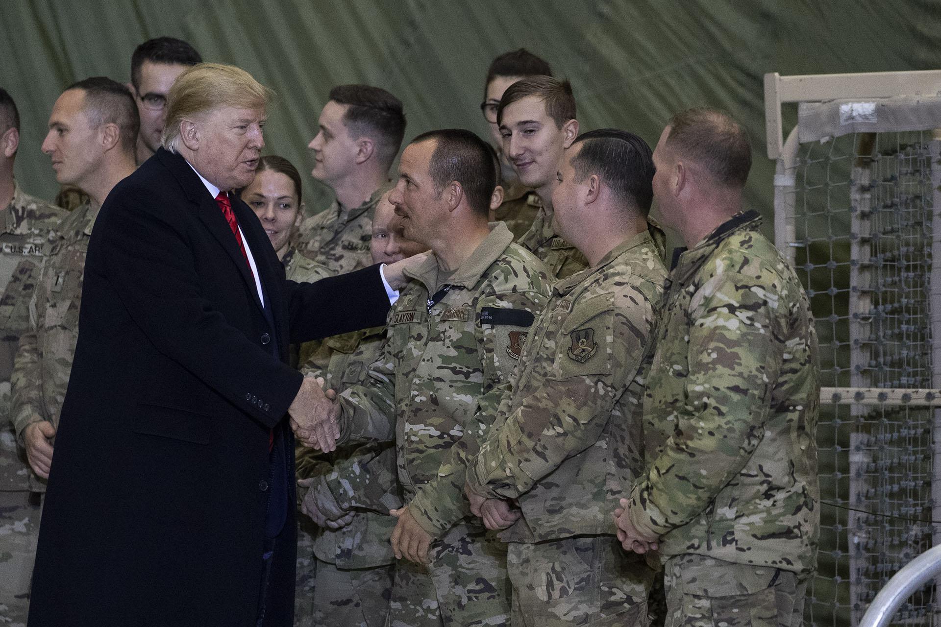 President Donald Trump greeting members of the military after speaking to members of the military during a surprise Thanksgiving Day visit, Thursday, Nov. 28, 2019, at Bagram Air Field, Afghanistan. (AP Photo / Alex Brandon)