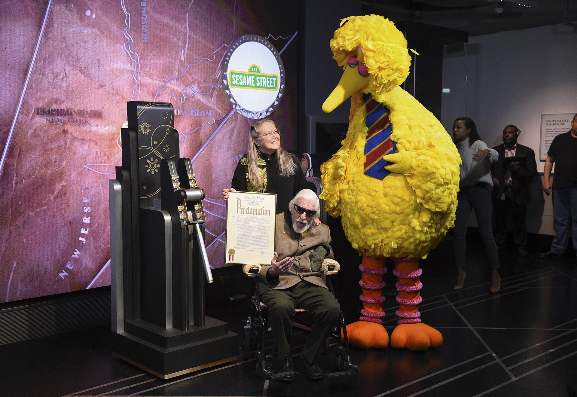 In this Friday, Nov. 8, 2019, file photo, Sesame Street’s Big Bird and puppeteer Caroll Spinney participate in the ceremonial lighting of the Empire State Building in honor of Sesame Street’s 50th anniversary in New York. (Photo by Evan Agostini / Invision/AP, File)