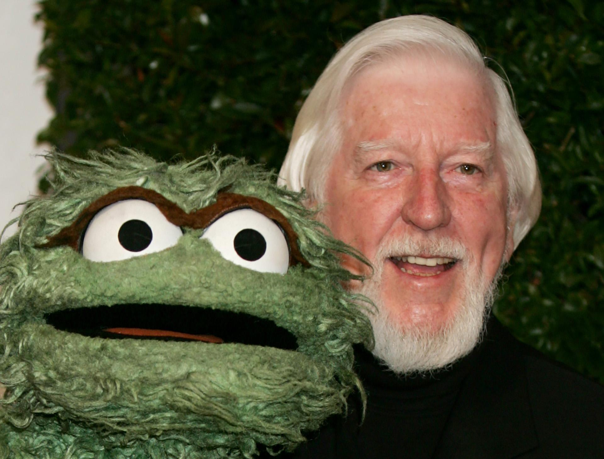 In this Thursday, April 27, 2006, file photo, Caroll Spinney, right, who portrays “Sesame Street” characters Oscar The Grouch, left, and Big Bird, arrives for the Daytime Emmy nominee party at the Hollywood Roosevelt Hotel in Los Angeles. (AP Photo / Reed Saxon, File)