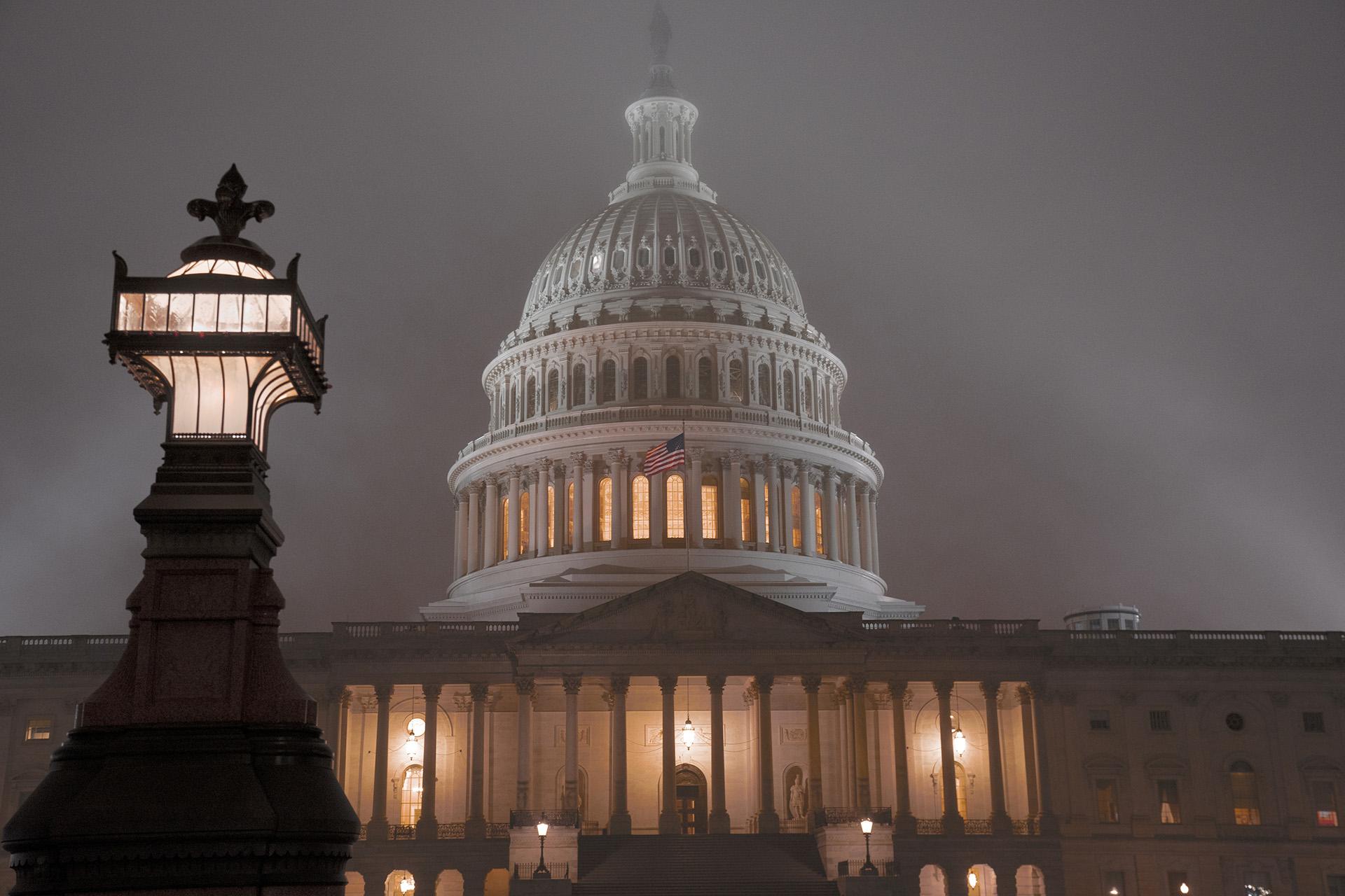 The U.S. Capitol in Washington is shrouded in mist, Friday night, Dec. 13, 2019.  (AP Photo / J. Scott Applewhite)