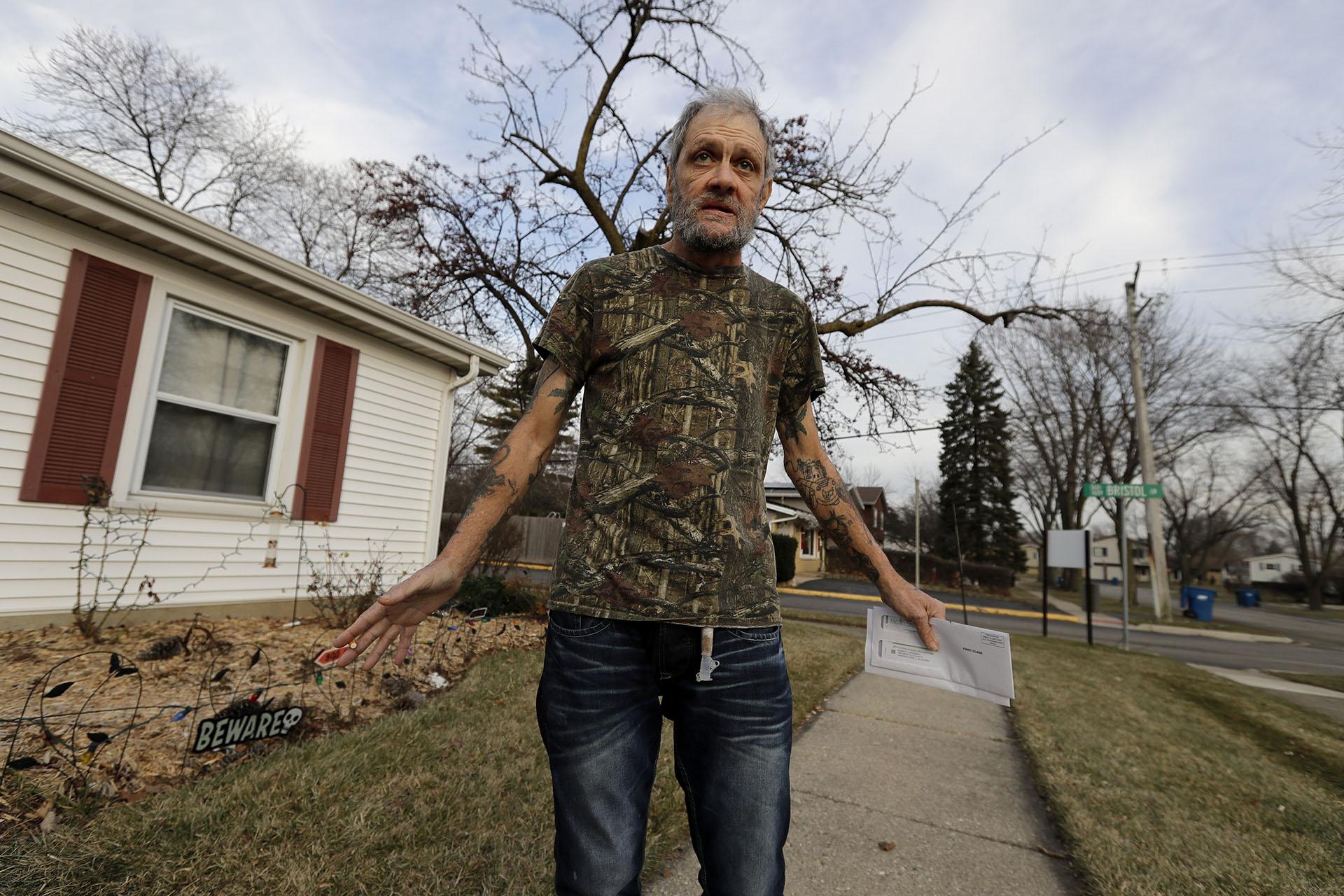 In this Friday, Dec. 20, 2019 photo, Bobby Goldberg walks in front of his home in suburban Chicago. Goldberg has filed a lawsuit claiming he was abused more than 1,000 times in multiple states and countries by the late Donald McGuire, a prominent American Jesuit priest who had close ties to Mother Teresa. (AP Photo / Nam Y. Huh)
