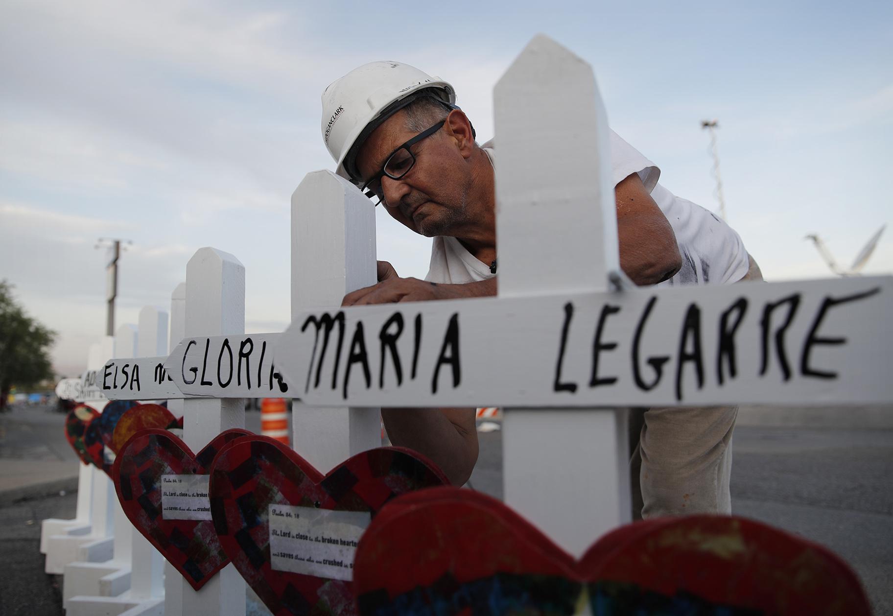 In this Aug. 5, 2019, file photo Greg Zanis prepares crosses to place at a makeshift memorial for victims of a mass shooting at a shopping complex in El Paso, Texas. (AP Photo / John Locher, File)