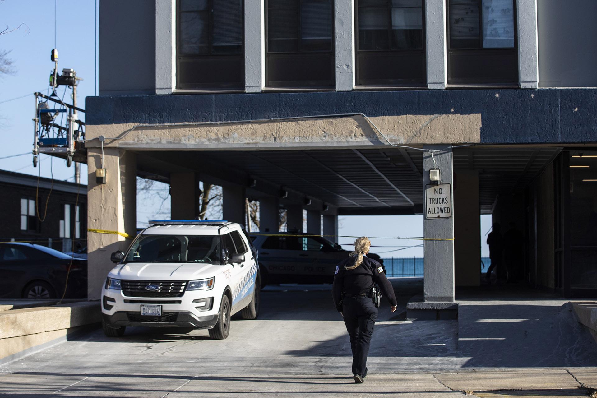 Chicago Police investigate at a South Shore neighborhood high-rise apartment building in the 7200 block of South South Shore Drive, Thursday morning, Jan. 2, 2020. (Ashlee Rezin Garcia / Chicago Sun-Times via AP)