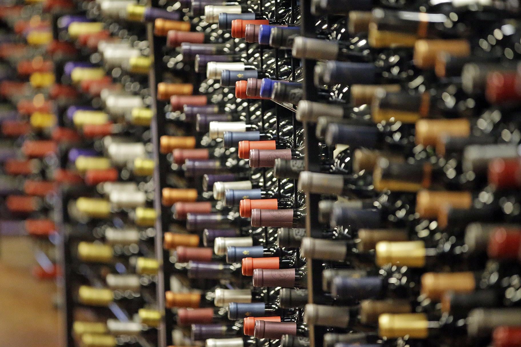 In this June 16, 2016, file photo, bottles of wine are displayed during a tour of a state liquor store, in Salt Lake City. According to federal health statistics, Americans are drinking more now than when Prohibition was enacted a century earlier. (AP Photo / Rick Bowmer, File)