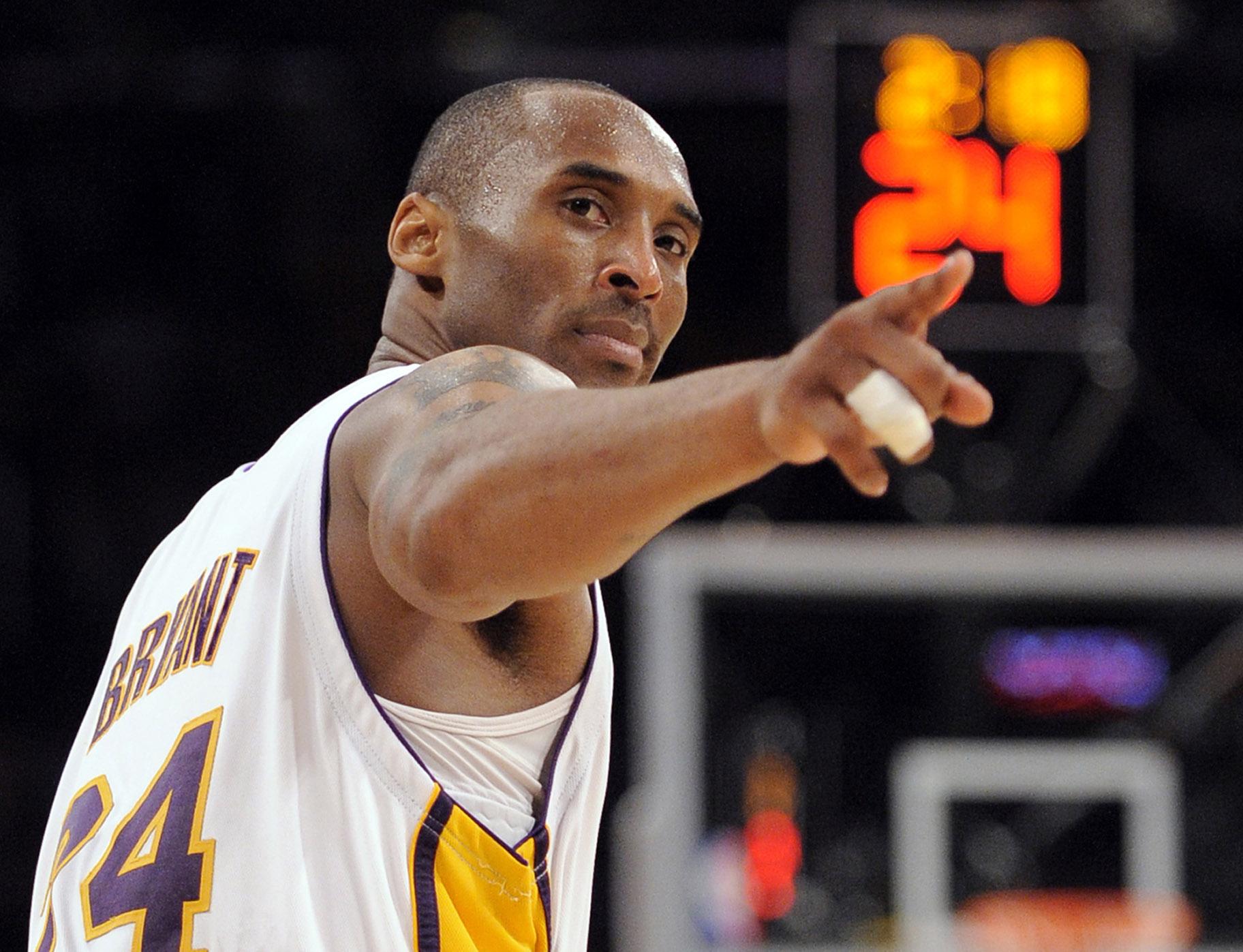 In this June 7, 2009, file photo, Los Angeles Lakers guard Kobe Bryant (24) points to a player behind him after making a basket in the closing seconds against the Orlando Magic in Game 2 of the NBA basketball finals, in Los Angeles. (AP Photo / Mark J. Terrill, File)