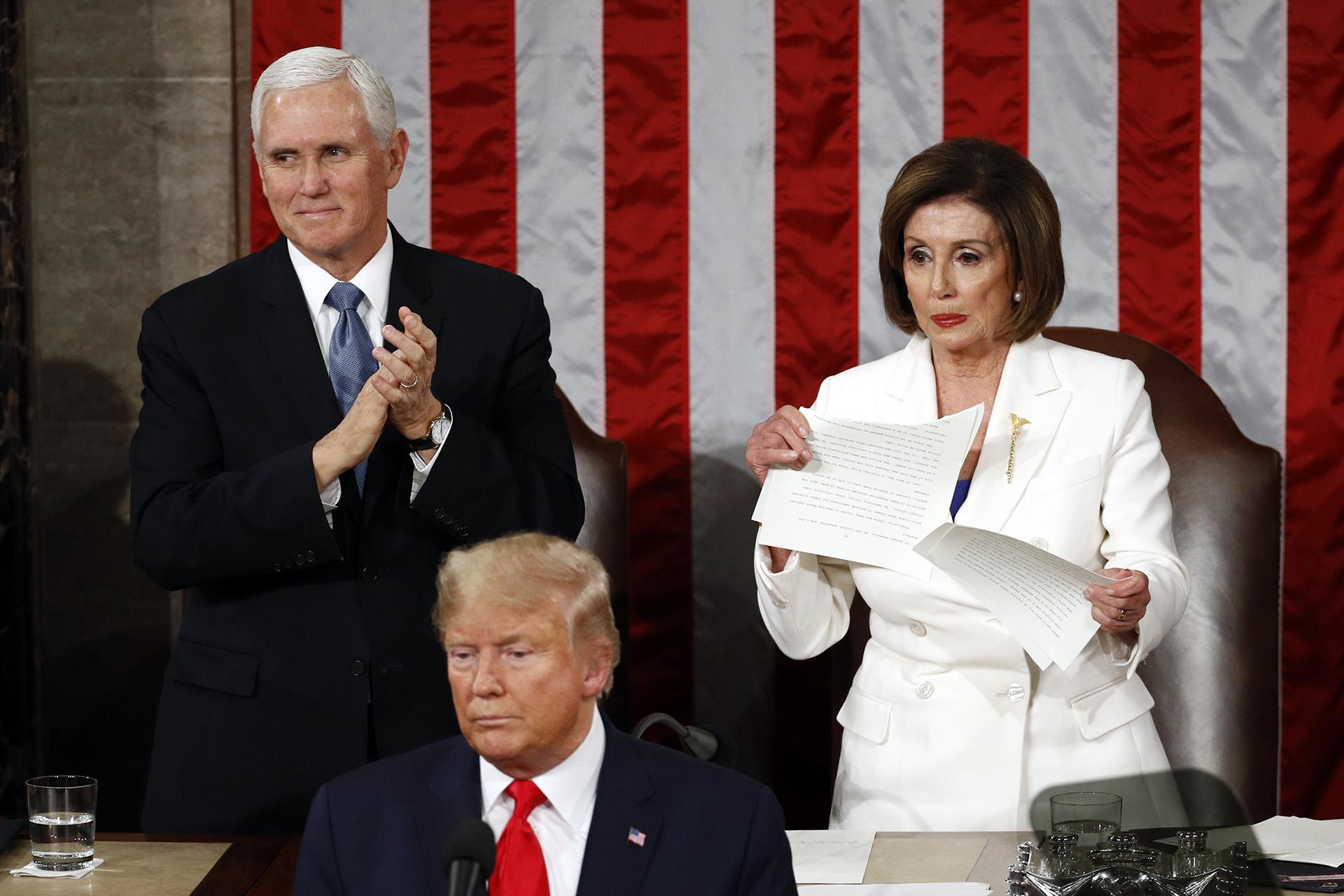 House Speaker Nancy Pelosi of Calif., tears her copy of President Donald Trump’s State of the Union address after he delivered it to a joint session of Congress on Capitol Hill in Washington, Tuesday, Feb. 4, 2020. Vice President Mike Pence is at left. (AP Photo / Patrick Semansky)