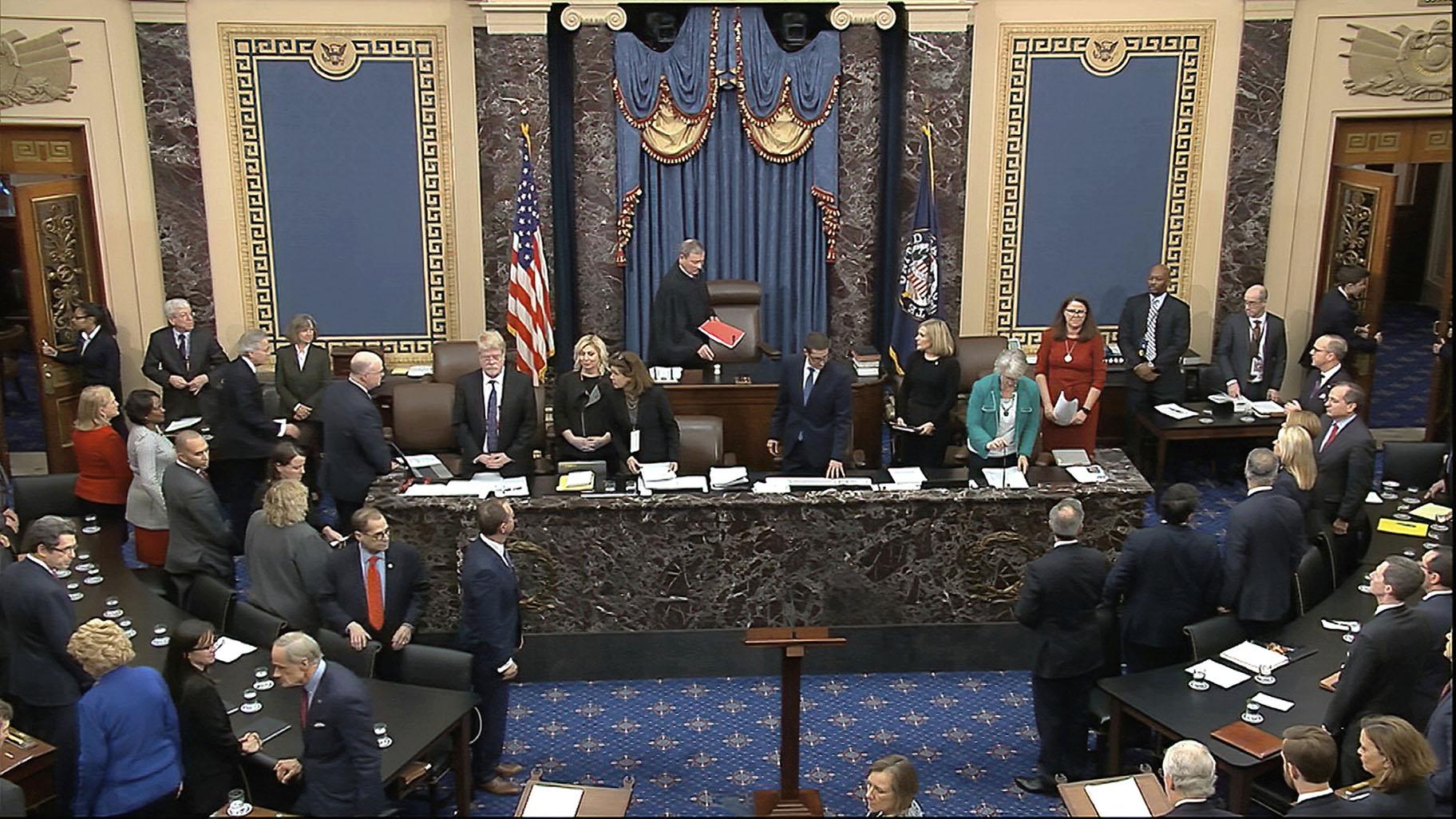 In this image from video, Chief Justice of the United States John Roberts arrives for the vote in the impeachment trial against President Donald Trump in the Senate at the U.S. Capitol in Washington, Wednesday, Feb. 5, 2020. (Senate Television via AP)