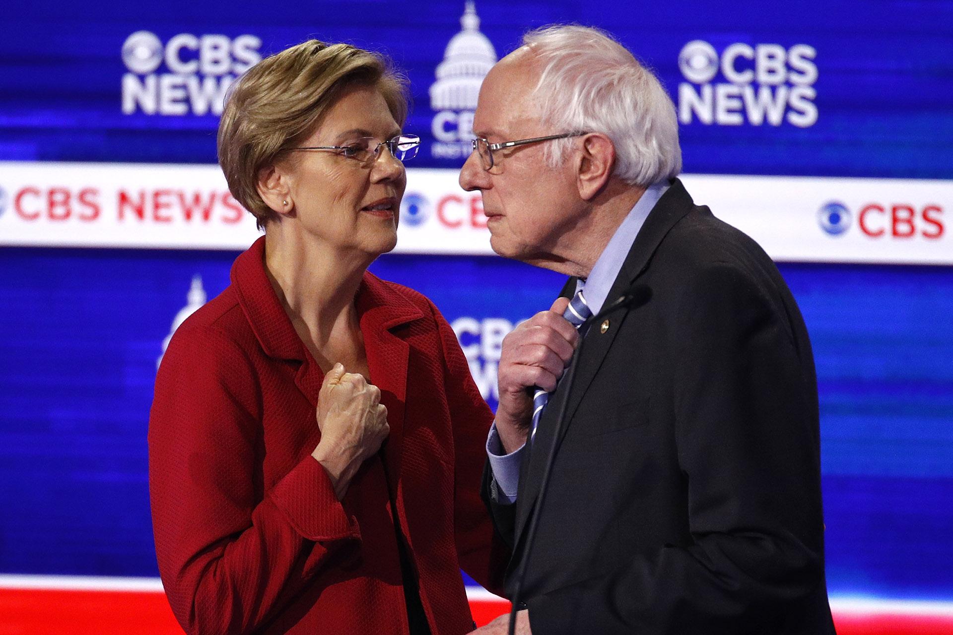 From left, Democratic presidential candidates, Sen. Elizabeth Warren, D-Mass., talks with Sen. Bernie Sanders, I-Vt., during a Democratic presidential primary debate at the Gaillard Center, Tuesday, Feb. 25, 2020, in Charleston, S.C., co-hosted by CBS News and the Congressional Black Caucus Institute. (AP Photo / Patrick Semansky)