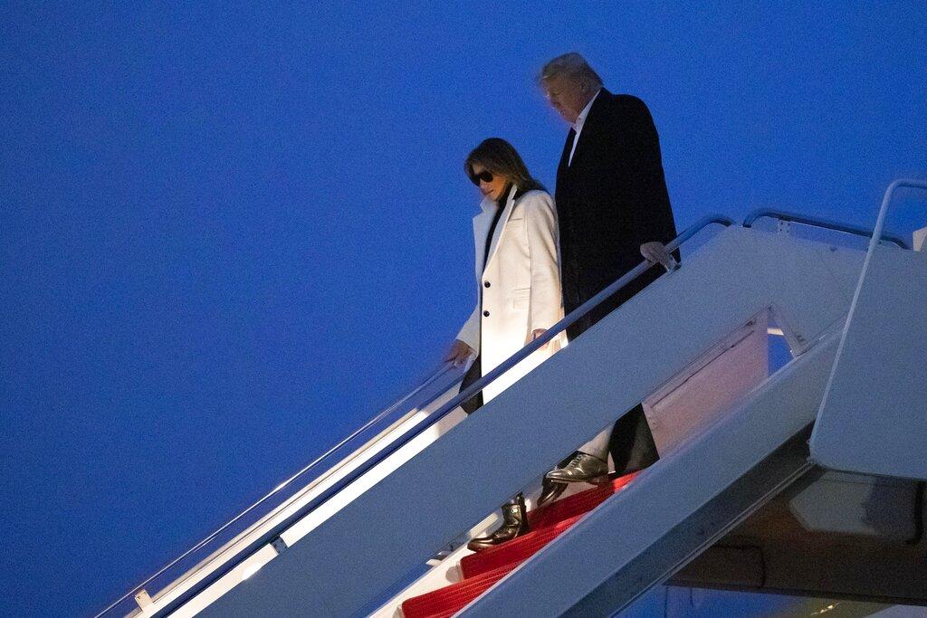President Donald Trump and first lady Melania Trump step off Air Force One upon their arrival Wednesday, Feb. 26, 2020 at Andrews Air Force Base, Md. Trump is returning from India. (AP Photo / Alex Brandon)