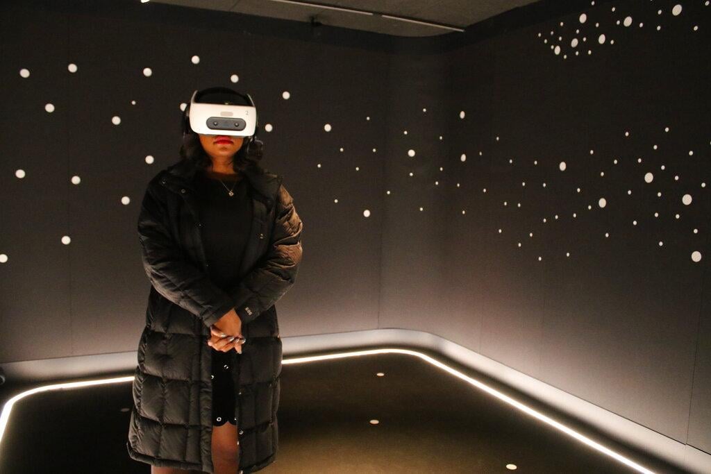In this Wednesday, Feb. 26, 2020 photo, a visitor experiences “The March” virtual reality exhibit at the DuSable Museum of African American History in Chicago ahead of the project’s launch. (AP Photo / Noreen Nasir)