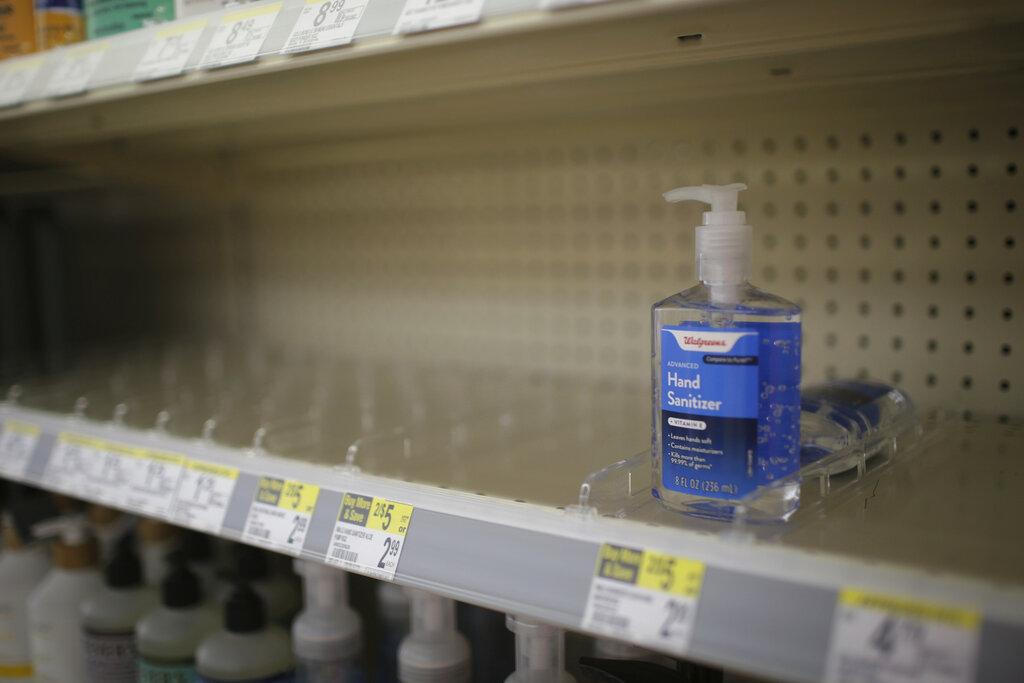 In this Feb. 28, 2020 file photo, rows of hand sanitizer are seen empty at a Walgreens in Idaho Falls, Idaho. (John Roark / The Idaho Post-Register via AP, file)