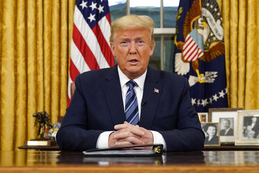 President Donald Trump speaks in an address to the nation from the Oval Office at the White House about the coronavirus Wednesday, March, 11, 2020, in Washington. (Doug Mills / The New York Times via AP, Pool)