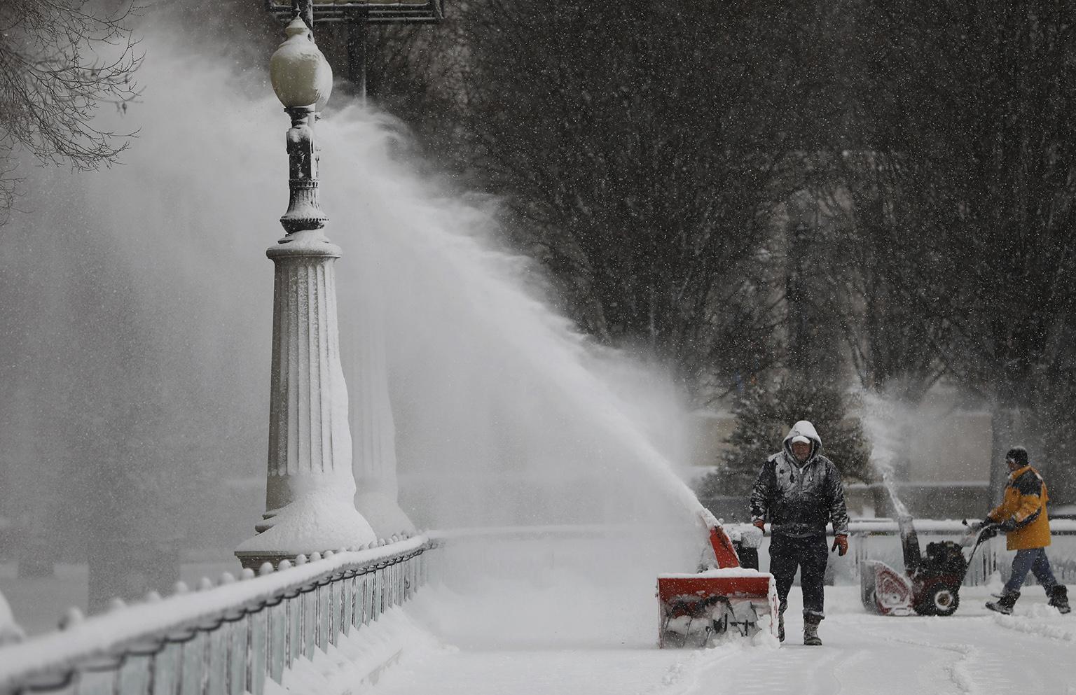 Snow-clearing efforts at Millennium Park following a snow storm on Saturday, Jan. 19, 2019. (Abel Uribe / Chicago Tribune via AP)