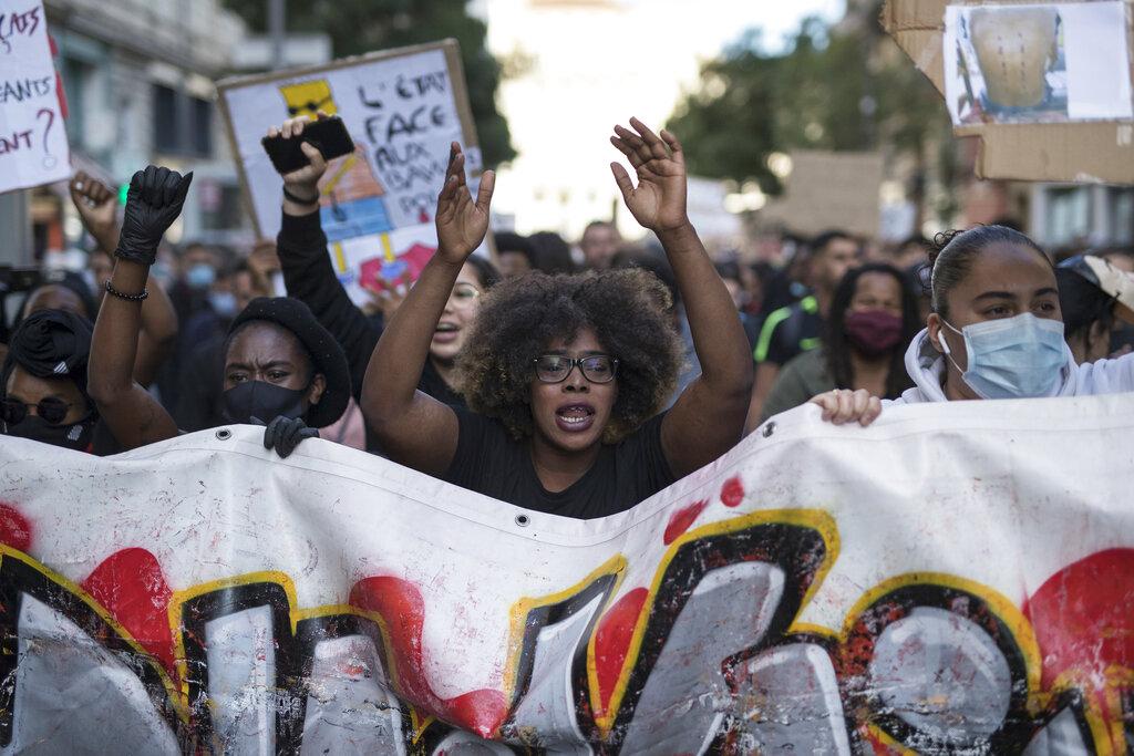 Hawa Traore chants during a march against police brutality and racism in Marseille, France, Saturday, June 13, 2020, organized by supporters of her brother Adama Traore, who died in police custody in 2016. (AP Photo / Daniel Cole)