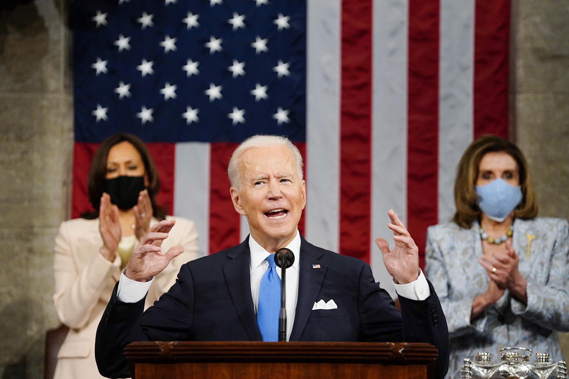 Vice President Kamala Harris, and House Speaker Nancy Pelosi of Calif., stand and applaud as President Joe Biden addresses a joint session of Congress, Wednesday, April 28, 2021, in the House Chamber at the U.S. Capitol in Washington. (Melina Mara / The Washington Post via AP, Pool)