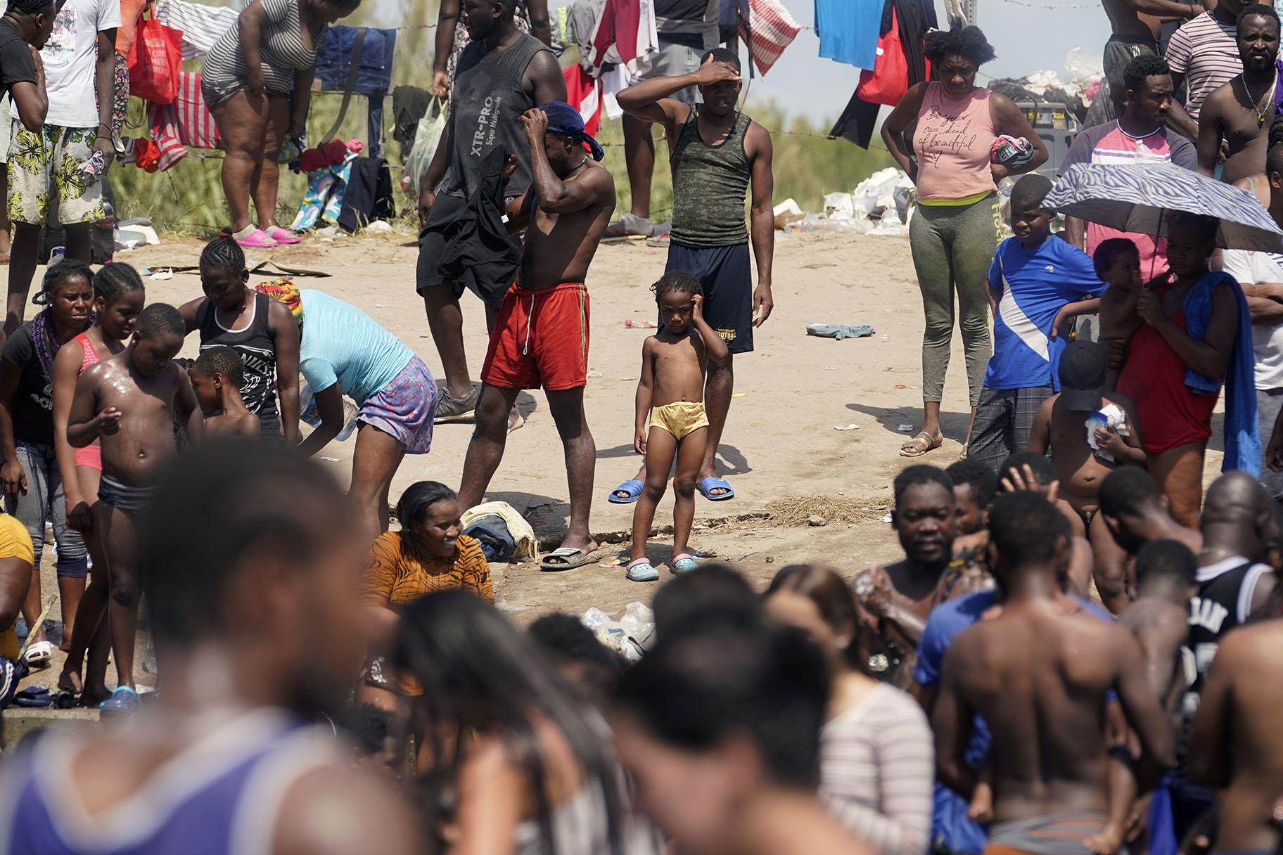 Haitian migrants gather on the banks of the Rio Grande after they crossed into the United States from Mexico, Saturday, Sept. 18, 2021, in Del Rio, Texas. (AP Photo / Eric Gay)